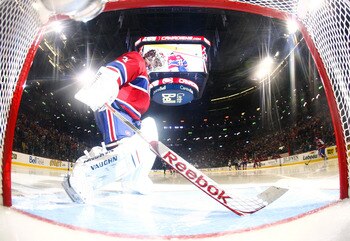 MONTREAL, CANADA - APRIL 26:  Carey Price #31 of the Montreal Canadiens prepares his crease at the start of the third period in Game Six of the Eastern Conference Quarterfinals against the Boston Bruins during the 2011 NHL Stanley Cup Playoffs at the Bell