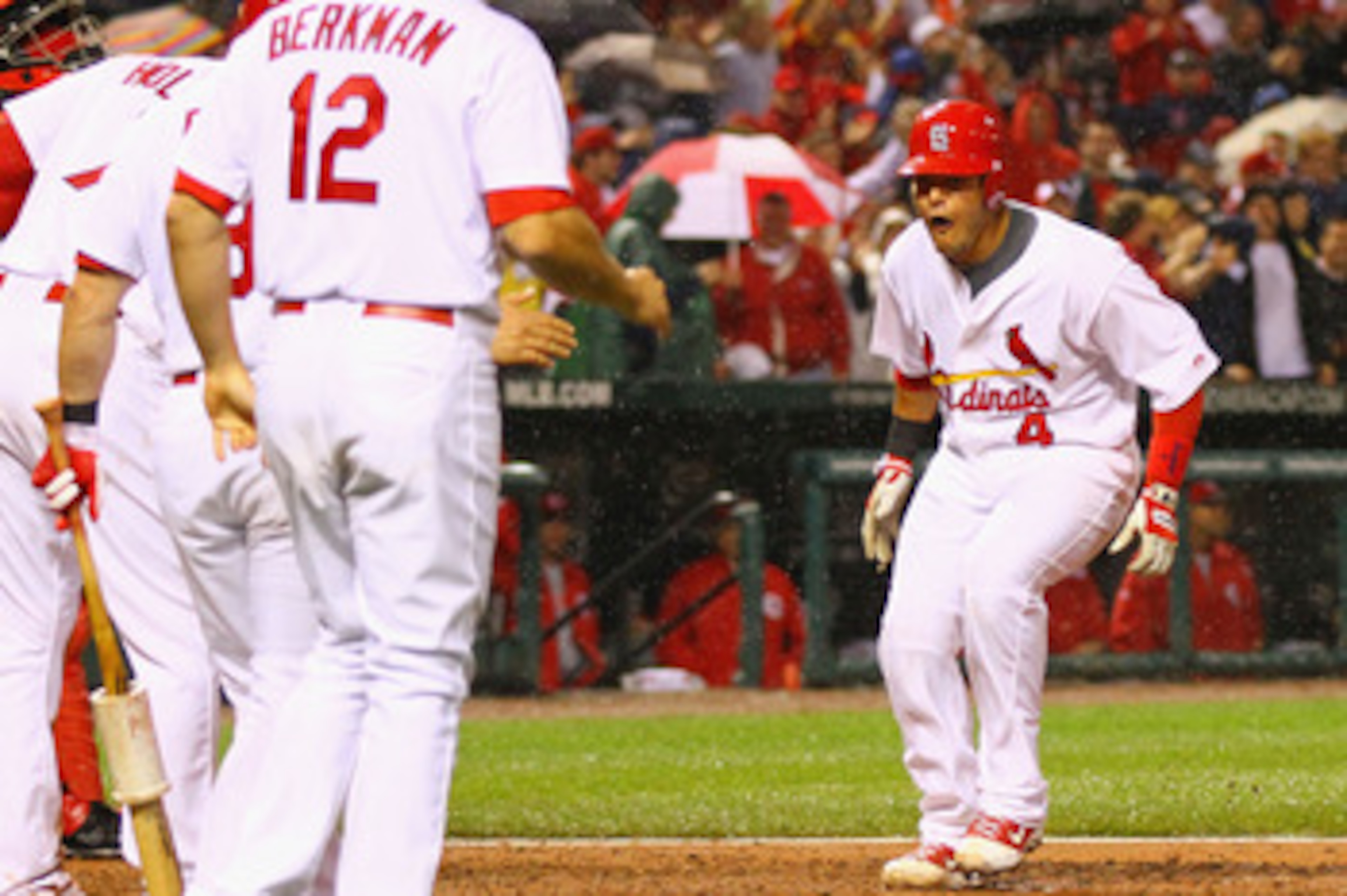 ST. LOUIS, MO - APRIL 24: Yadier Molina #4 of the St. Louis Cardinals celebrates his three-run home run against the Cincinnati Reds at Busch Stadium on April 24, 2011 in St. Louis, Missouri.  (Photo by Dilip Vishwanat/Getty Images)