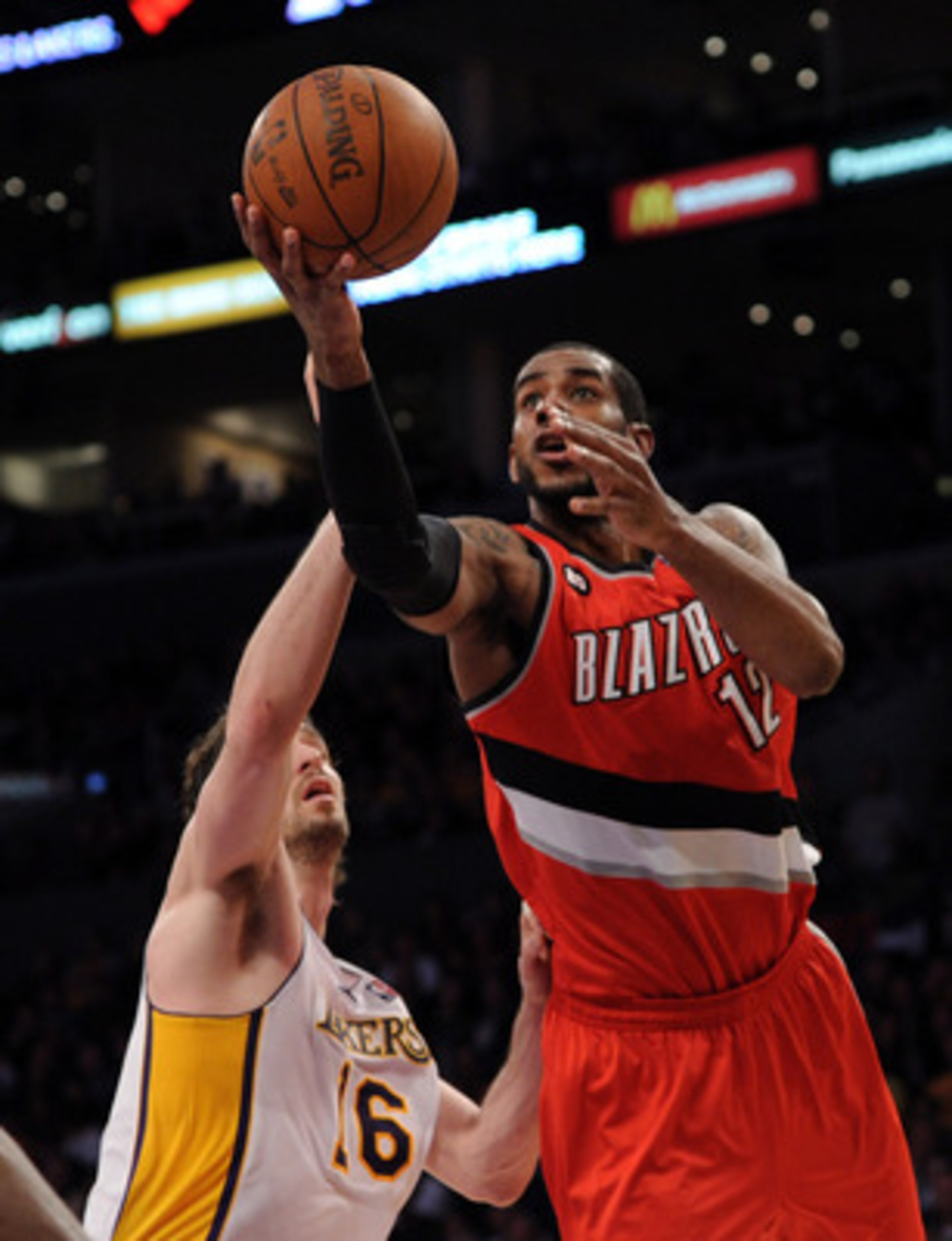 LOS ANGELES, CA - MARCH 20:  LaMarcus Aldridge #12 of the Portland Trail Blazers goes in for a layup in front of Pau Gasol #16 of the Los Angeles Lakers at the Staples Center on March 20, 2011 in Los Angeles, California.  NOTE TO USER: User expressly ackn
