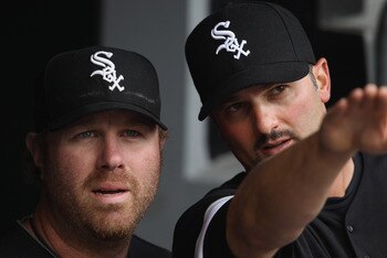 CHICAGO, IL - APRIL 07: Paul Konerko #14 of the Chicago White Sox (R) talks about the stadium to teammate Adam Dunn #32 before the home opener against the Tampa Bay Rays at U.S. Cellular Field on April 7, 2011 in Chicago, Illinois. (Photo by Jonathan Dani