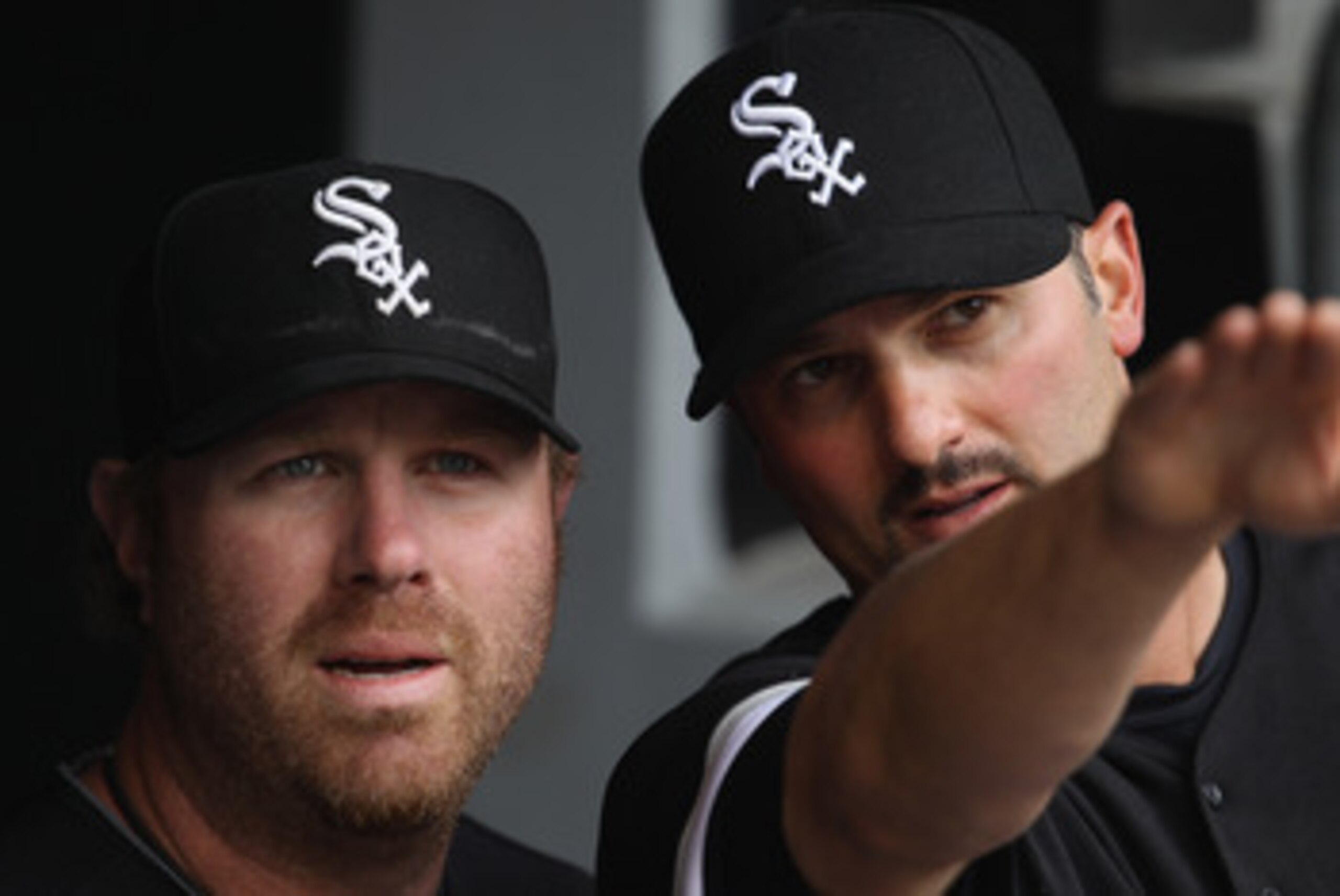 CHICAGO, IL - APRIL 07: Paul Konerko #14 of the Chicago White Sox (R) talks about the stadium to teammate Adam Dunn #32 before the home opener against the Tampa Bay Rays at U.S. Cellular Field on April 7, 2011 in Chicago, Illinois. (Photo by Jonathan Dani