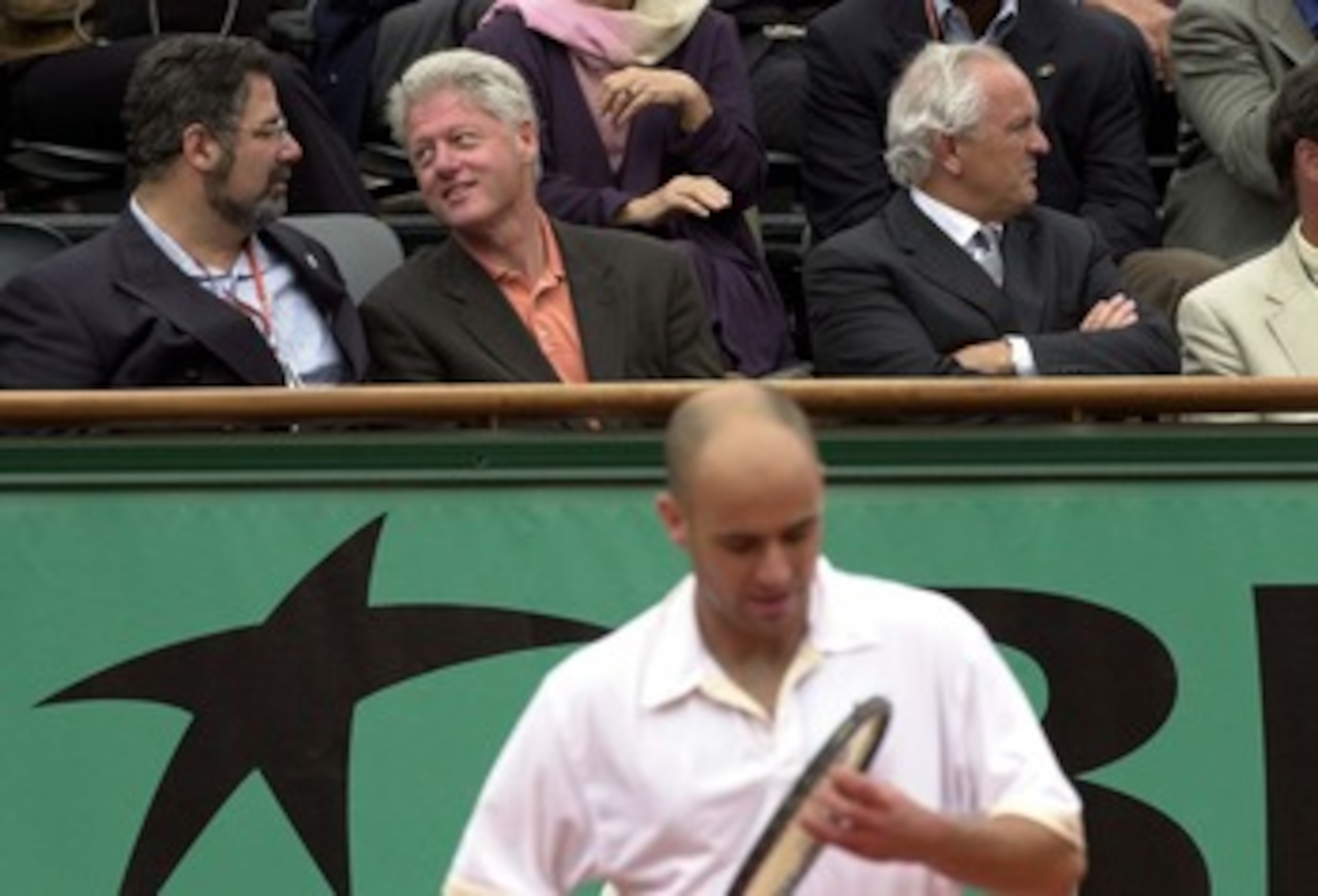 6 Jun 2001:  Bill Clinton watches Andre Agassi of the USA  in his Quarter final match against Sebastien Grosjean of France during the French Open Tennis at Roland Garros, Paris, France....DIGITAL IMAGE. Mandatory Credit: Clive Brunskill/ALLSPORT