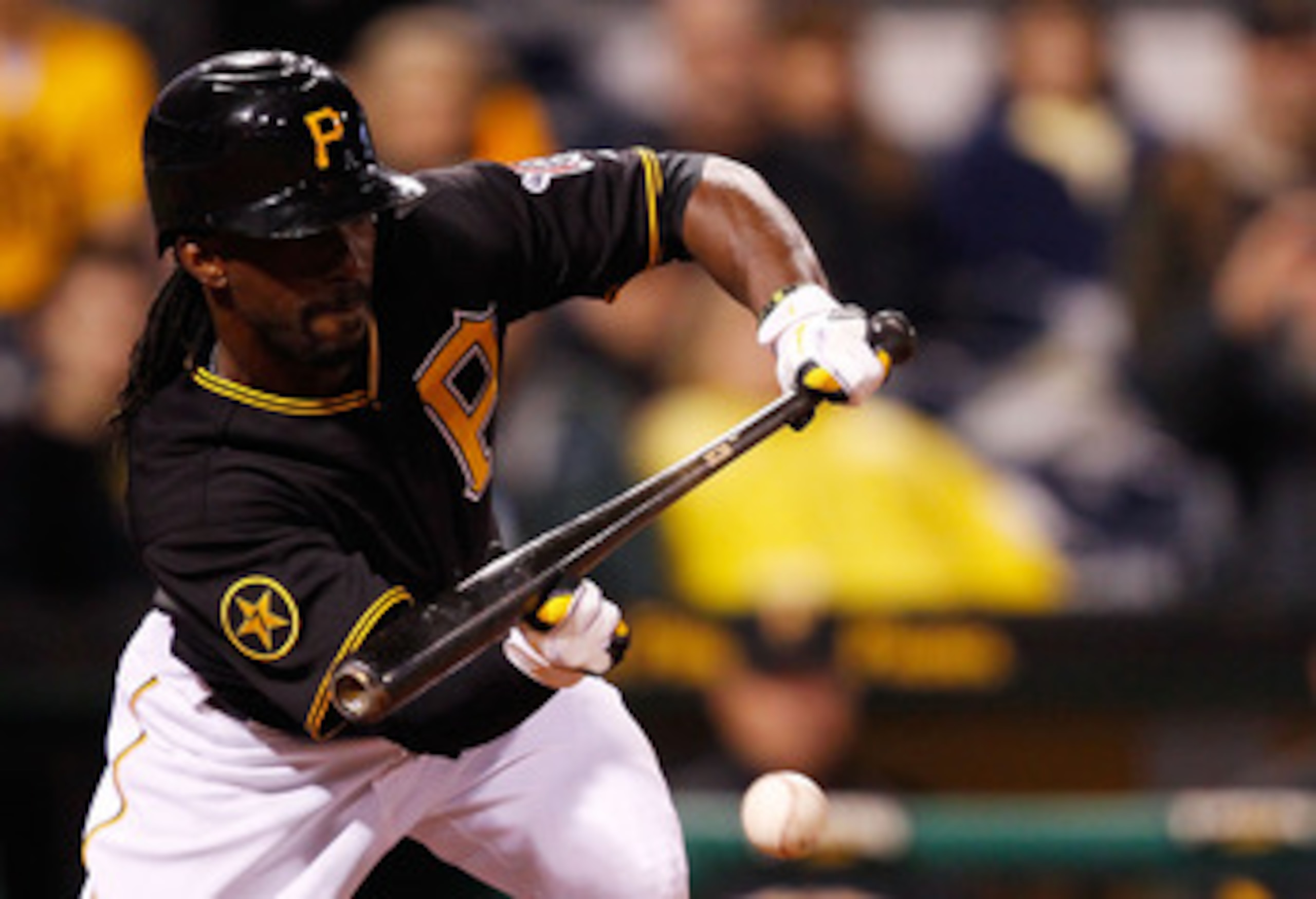 PITTSBURGH - MAY 06:  Andrew McCutchen #22 of the Pittsburgh Pirates lays down a bunt against the Houston Astros during the game on May 6, 2011 at PNC Park in Pittsburgh, Pennsylvania.  (Photo by Jared Wickerham/Getty Images)