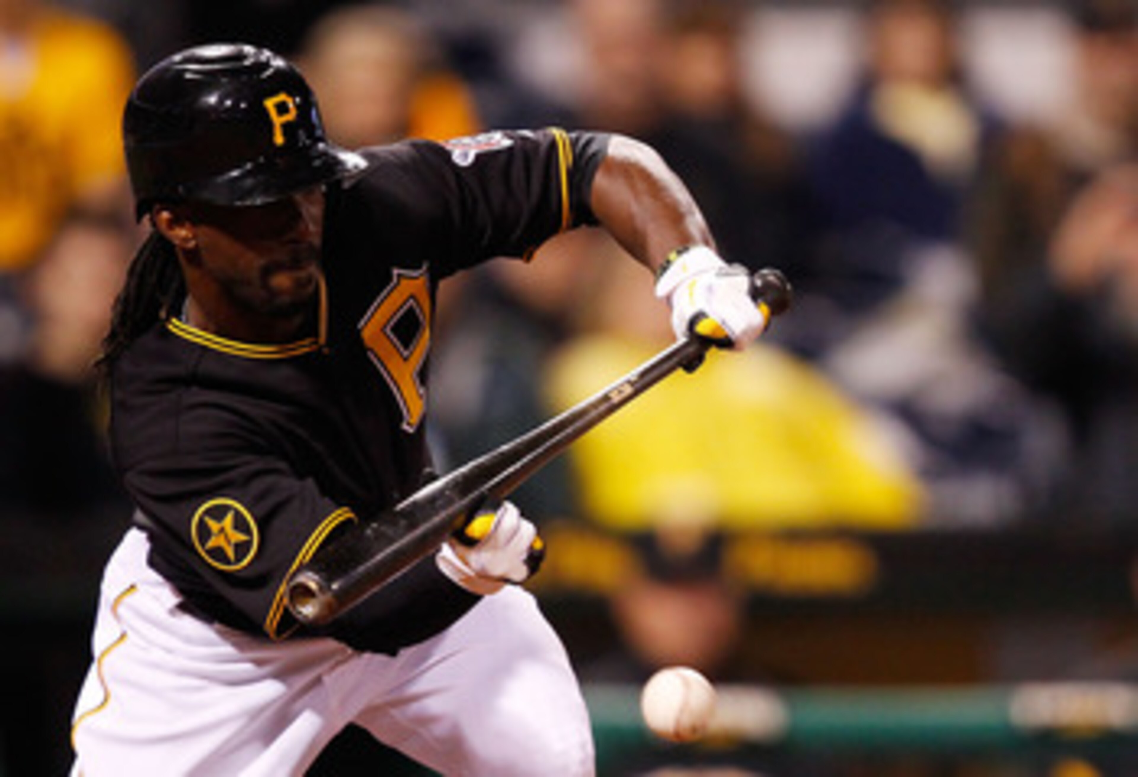 PITTSBURGH - MAY 06:  Andrew McCutchen #22 of the Pittsburgh Pirates lays down a bunt against the Houston Astros during the game on May 6, 2011 at PNC Park in Pittsburgh, Pennsylvania.  (Photo by Jared Wickerham/Getty Images)