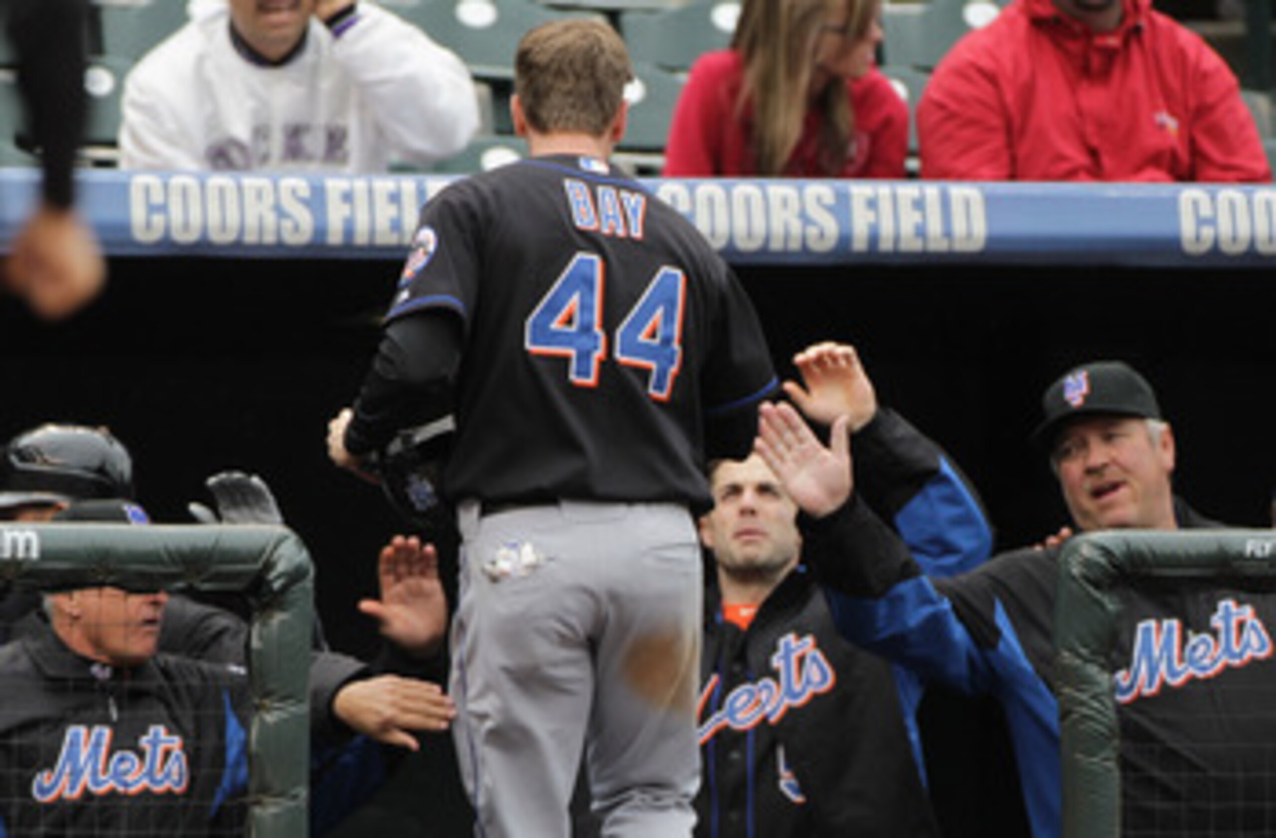 DENVER, CO - MAY 12:  Jason Bay #44 of the New York Mets is welcomed back to the dugout after scoring on a sacrifice fly by Josh Thole of the Mets to give the Mets a 3-1 lead over the Colorado Rockies in the fourth inning at Coors Field on May 12, 2011 in