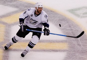 BOSTON, MA - MAY 14:  Ryan Malone #6 of the Tampa Bay Lightning controls the puck against the Boston Bruins in Game One of the Eastern Conference Finals during the 2011 NHL Stanley Cup Playoffs at TD Garden on May 14, 2011 in Boston, Massachusetts.  (Phot