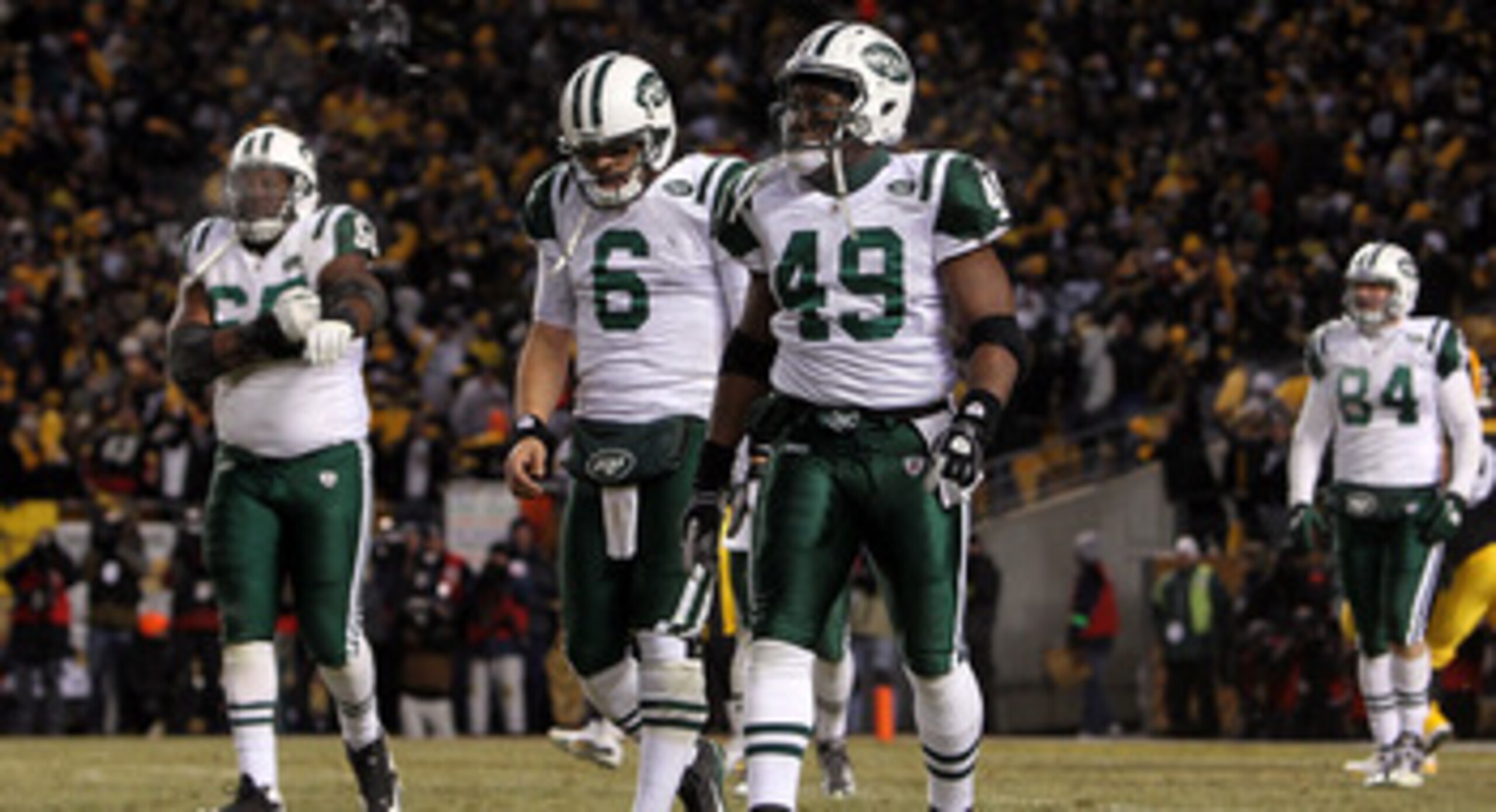 PITTSBURGH, PA - JANUARY 23:  Tony Richardson #49 and Mark Sanchez #6 of the New York Jets walk towards the sideline late in the fourth quarter against the Pittsburgh Steelers during the 2011 AFC Championship game at Heinz Field on January 23, 2011 in Pit