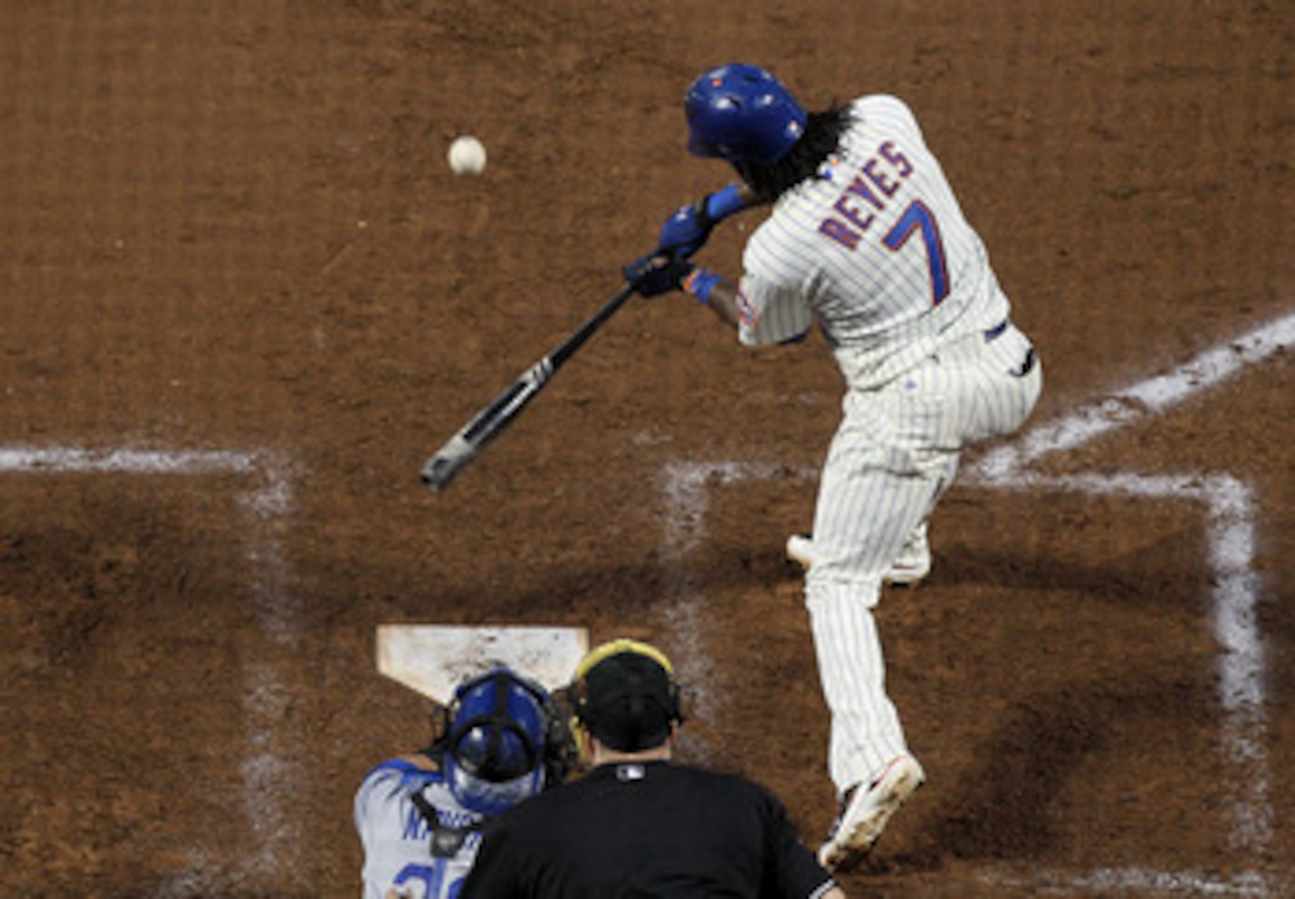 NEW YORK, NY - MAY 07:  Jose Reyes #7 of the New York Mets connects on a second inning RBI single against the Los Angeles Dodgers on May 7, 2011 at Citi Field in the Flushing neighborhood of the Queens borough of New York City.  (Photo by Jim McIsaac/Gett