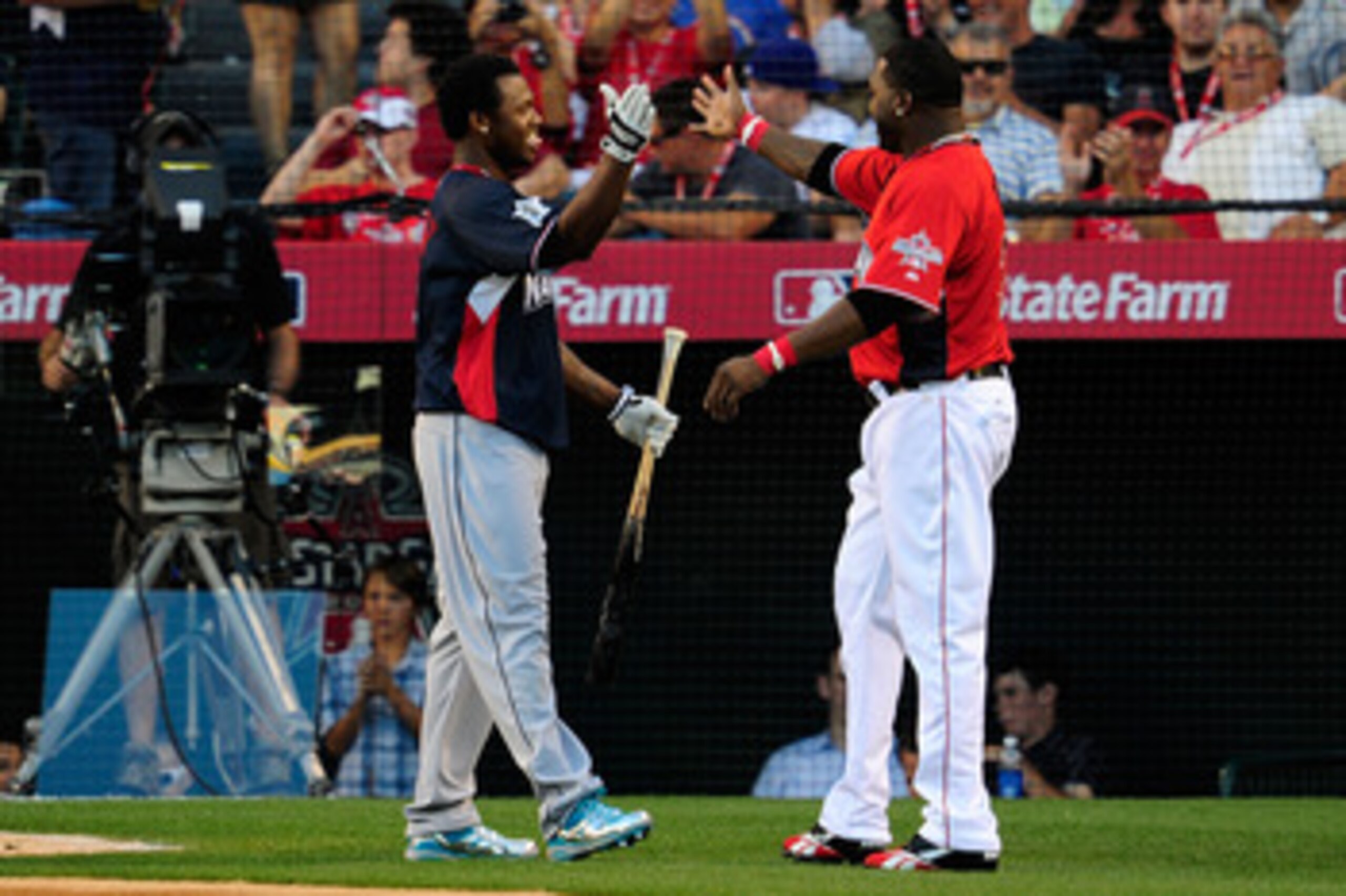 ANAHEIM, CA - JULY 12:  National League All-Star Hanley Ramirez #2 of the Florida Marlins and American League All-Star David Ortiz #34 of the Boston Red Sox shake hands on the field during the second round of the 2010 State Farm Home Run Derby during All-