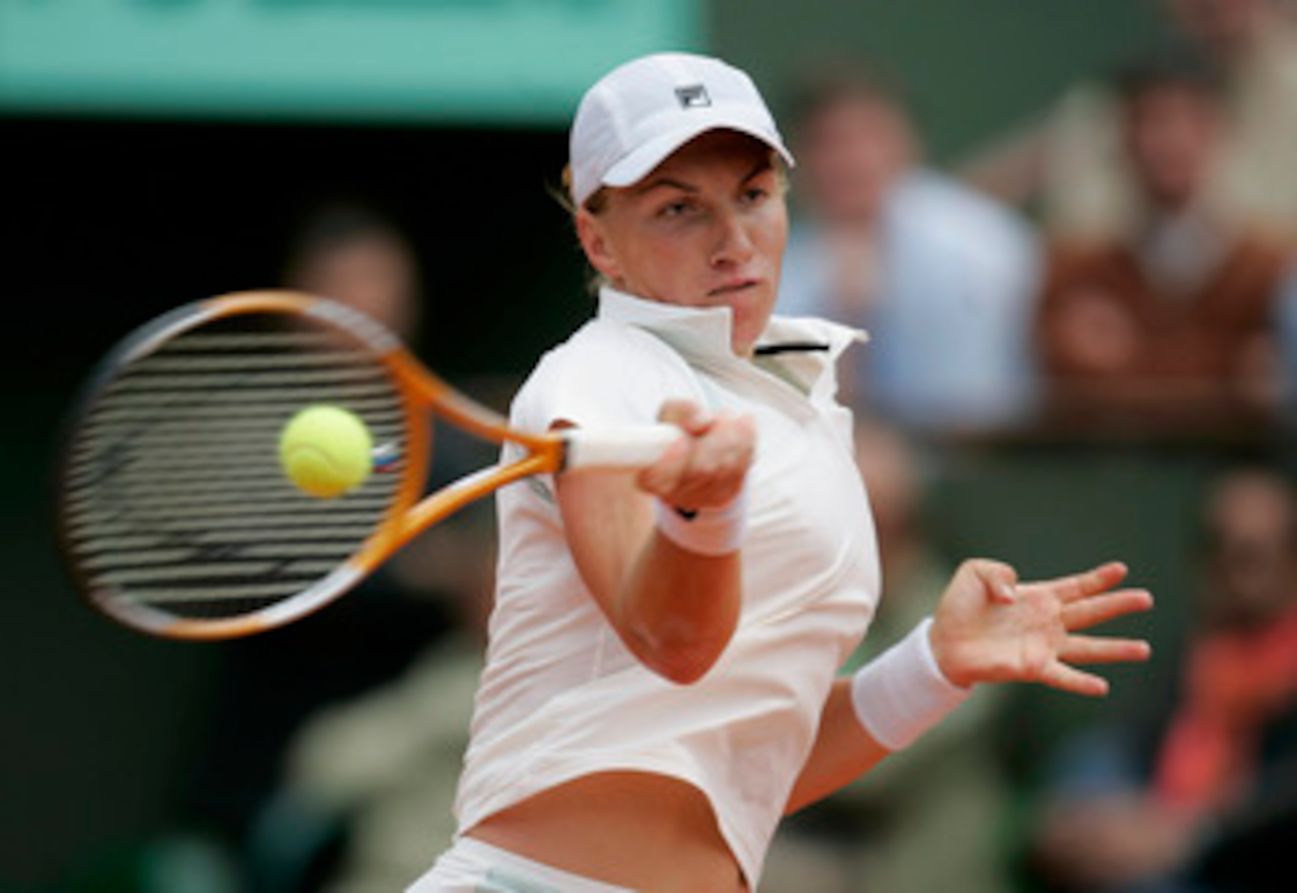PARIS - MAY 30:  Svetlana Kuznetsova of Russia in action during her fourth round match against Justine Henin-Hardenne of Belgium during the eighth day of the French Open at Roland Garros on May 30, 2005 in Paris, France.  (Photo by Clive Mason/Getty Image