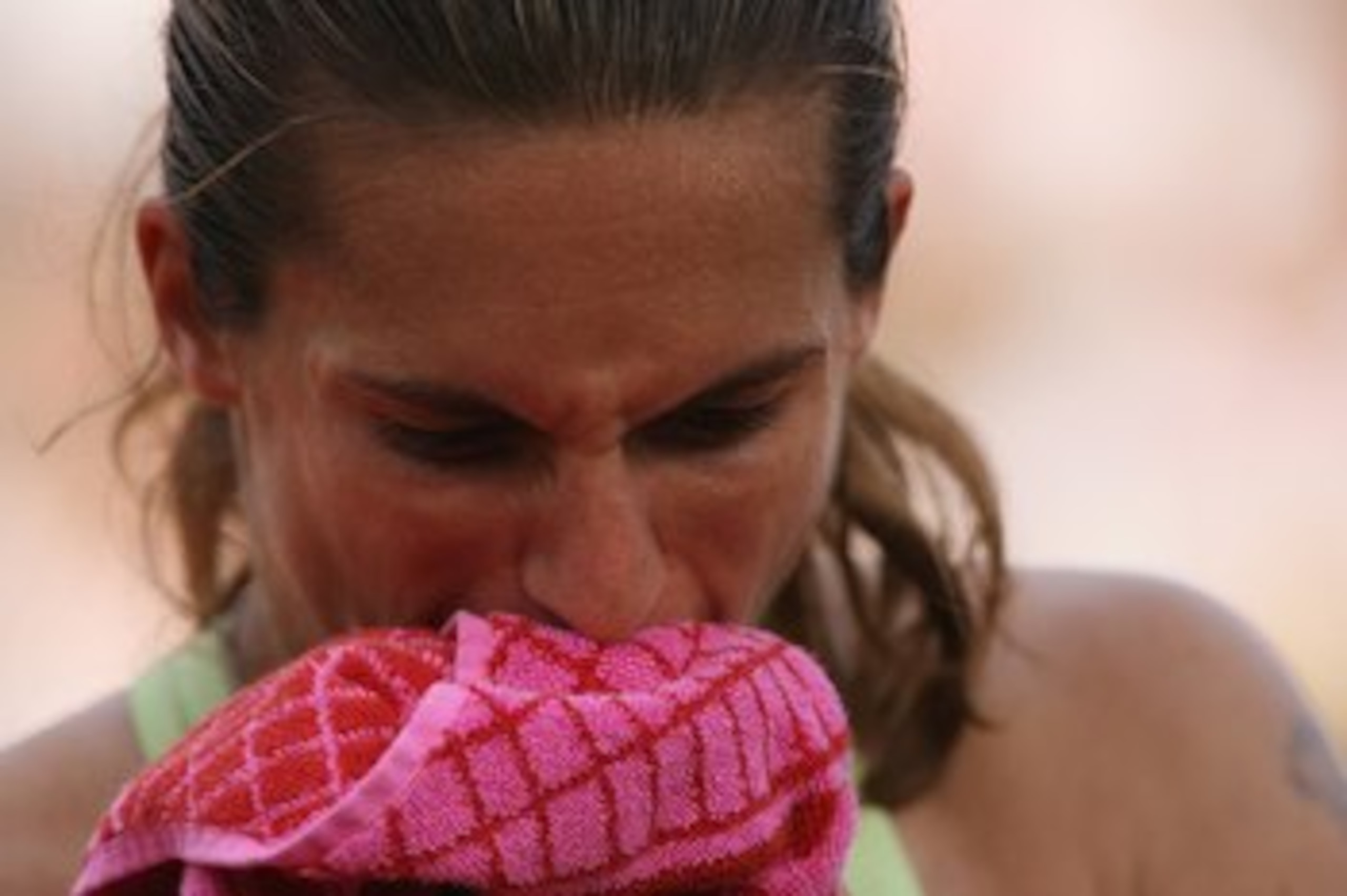 PARIS - JUNE 04:  Amelie Mauresmo of France looks dejected against Nicole Vaidisova of the Czech Republic during day eight of the French Open at Roland Garros on June 4, 2006 in Paris, France.  (Photo by Clive Brunskill/Getty Images)