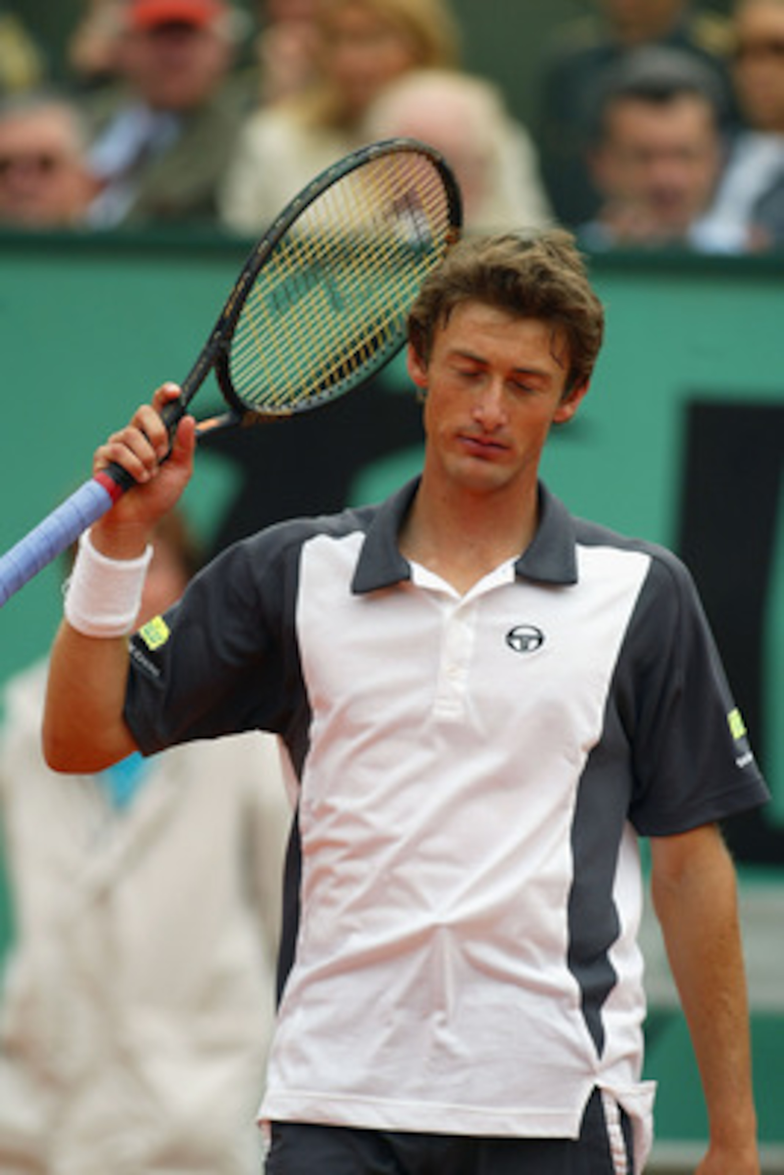 Paris - June 9:  A dejected Juan Carlos Ferrero of Spain as he lose the second set to Albert Costa of Spain in the mens singles final during the French Open at Roland Garros in Paris on June 9, 2002. (Photo by Phil Cole/Getty Images)