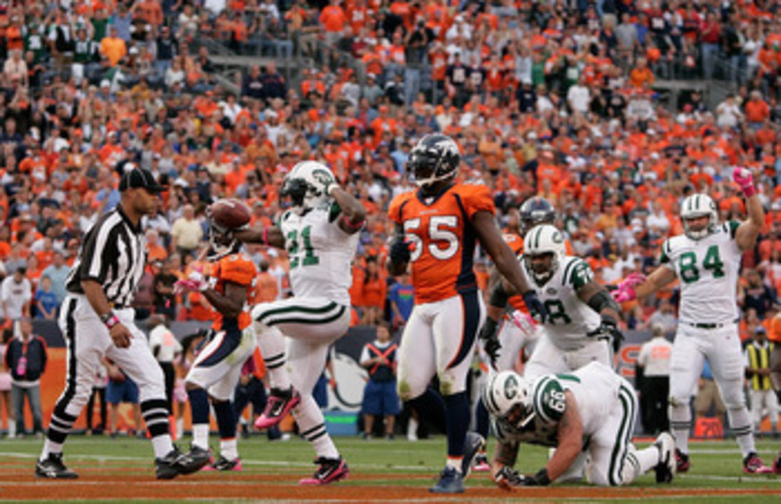 DENVER - OCTOBER 17:  Running back LaDainian Tomlinson #21 of the New York Jets celebrates his touchdown against the Denver Broncos at INVESCO Field at Mile High on October 17, 2010 in Denver, Colorado. The Jets defeated the Broncos 24-20. (Photo by Justi