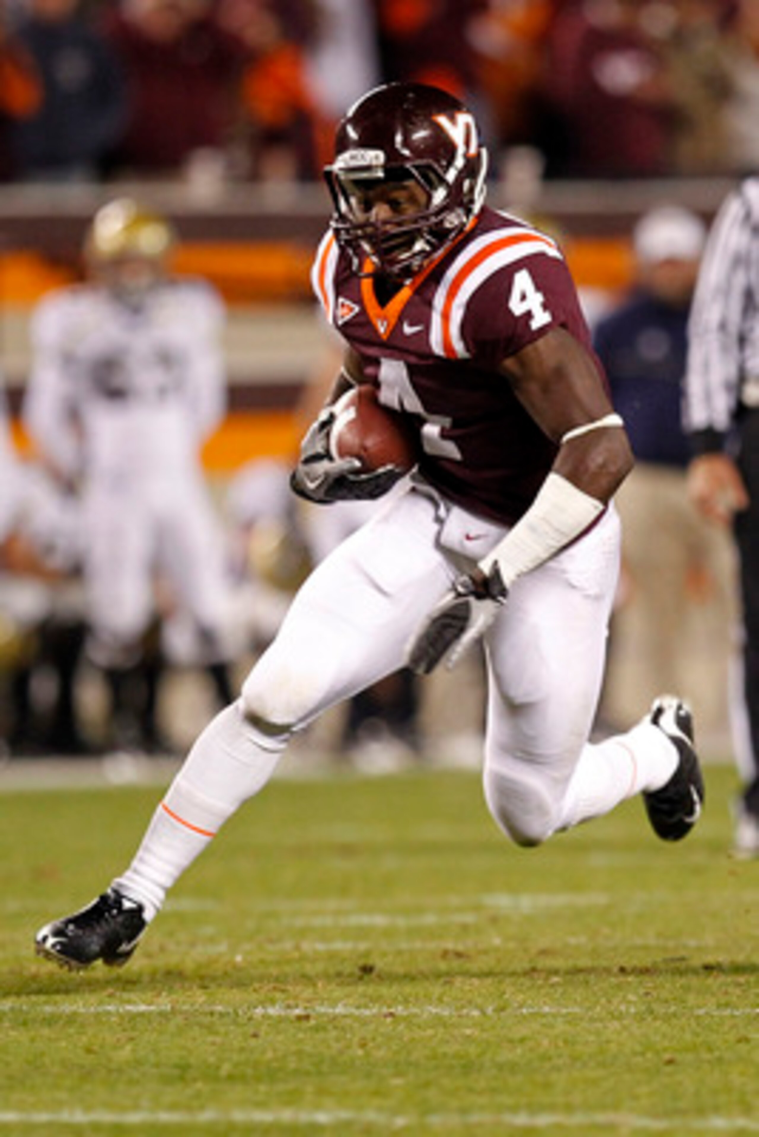 BLACKSBURG, VA - NOVEMBER 04:  Running back David Wilson #4 of the Virginia Tech Hokies runs with the ball against the Georgia Tech Yellow Jackets at Lane Stadium on November 4, 2010 in Blacksburg, Virginia.  (Photo by Geoff Burke/Getty Images)