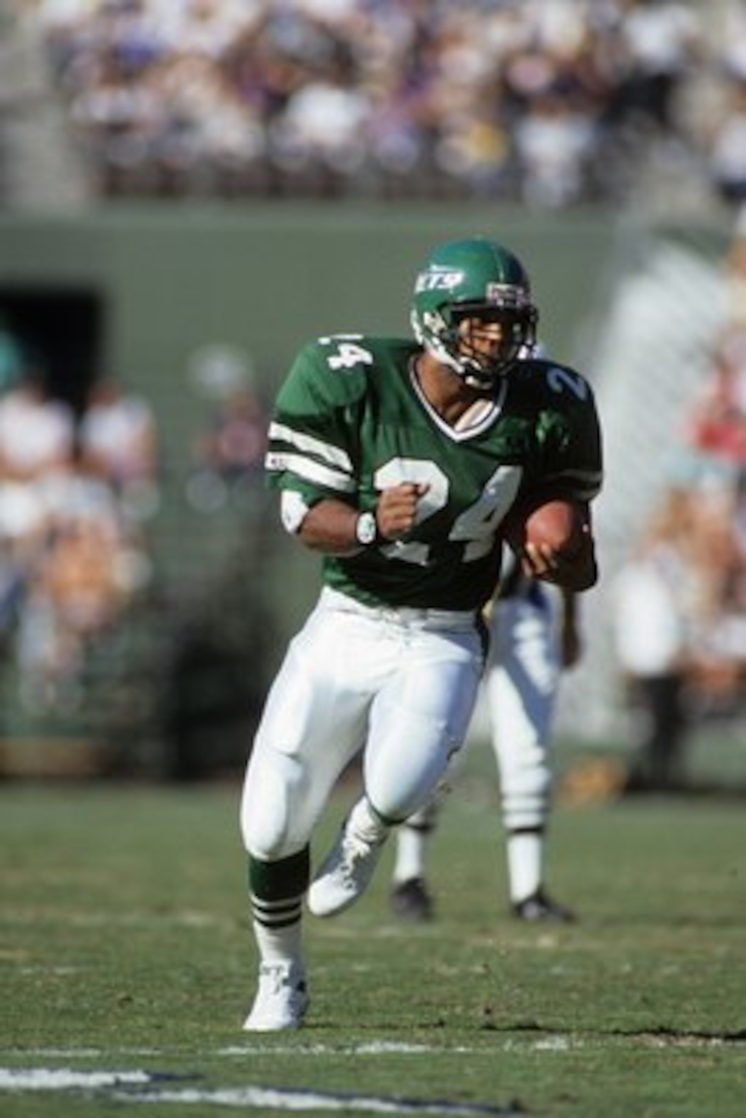 SAN DIEGO, CA - DECEMBER 2:  Running back Freeman McNeil #24 of the New York Jets runs the ball during a game against the San Diego Chargers at Jack Murphy Stadium on December 2, 1990 in San Diego, California.  The San Diego Chargers won 38-17  (Photo by 