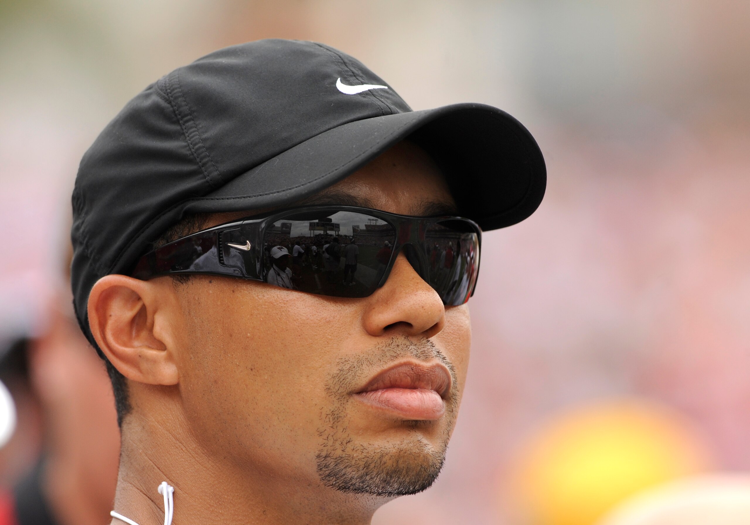 TAMPA, FL - SEPTEMBER 28:  Golfer Tiger Woods watches play from the sidelines as the Tampa Bay Buccaneers defeat the Green Bay Packers at Raymond James Stadium on September 28, 2008 in Tampa, Florida.  (Photo by Al Messerschmidt/Getty Images)