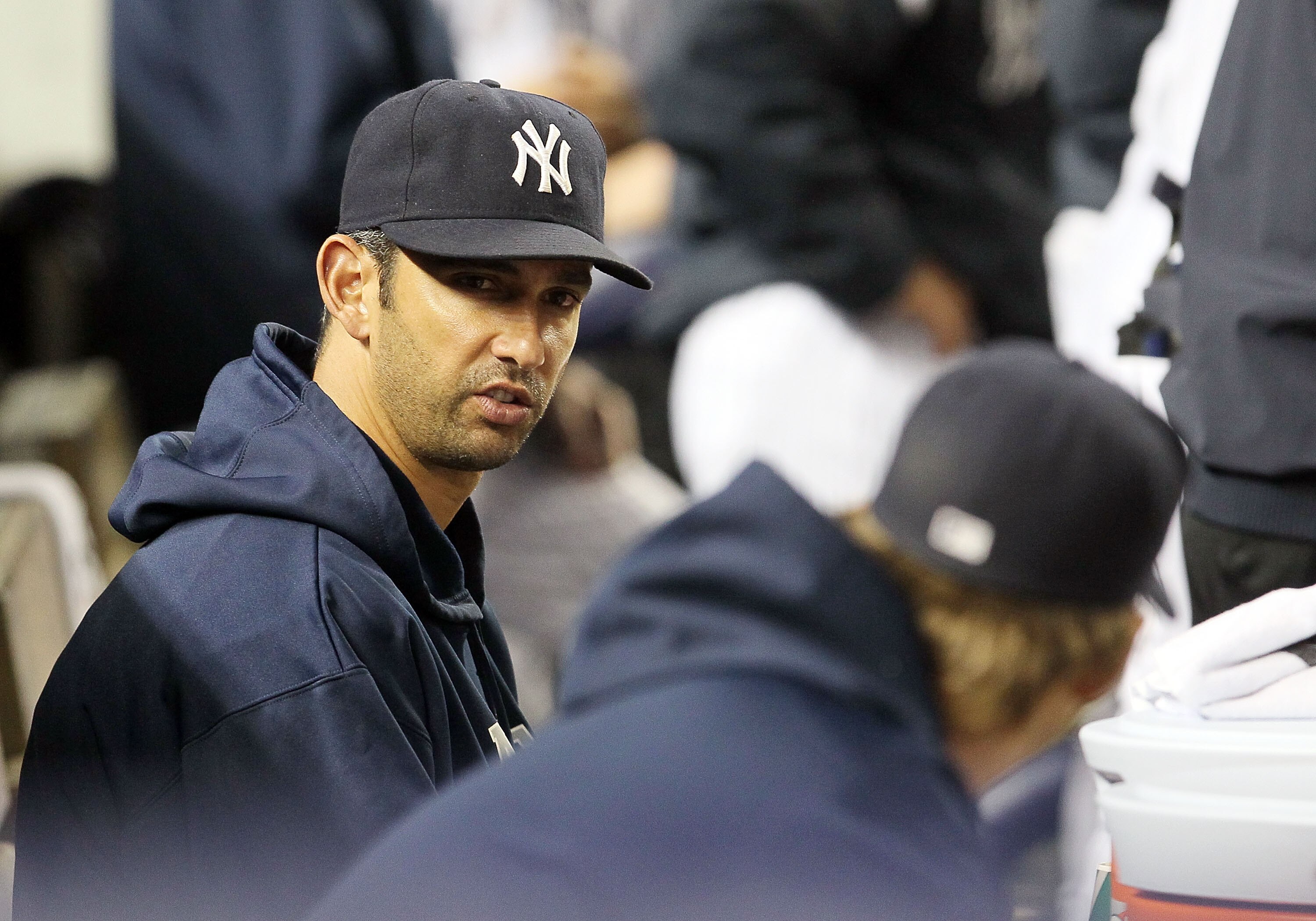 NEW YORK, NY - MAY 14:  Jorge Posada #20 of the New York Yankees looks on from the bench during the game against the Boston Red Sox on May 14, 2011 at Yankee Stadium in the Bronx borough of New York City. Posada pulled himself from the starting lineup pri