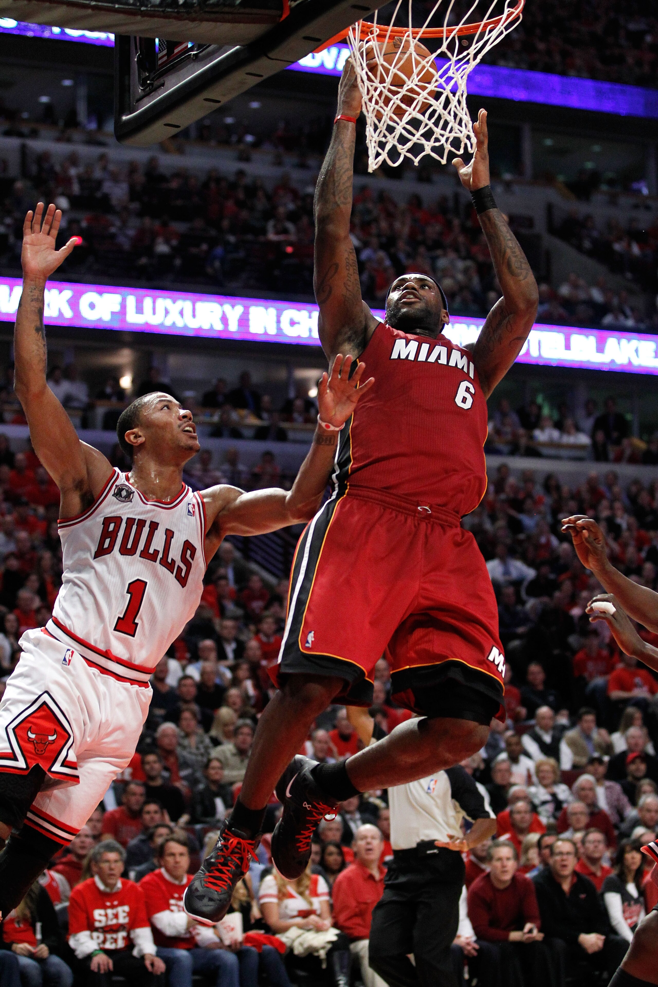 CHICAGO, IL - MAY 18:  LeBron James #6 of the Miami Heat drives for a shot attempt against Derrick Rose #1 of the Chicago Bulls in Game Two of the Eastern Conference Finals during the 2011 NBA Playoffs on May 18, 2011 at the United Center in Chicago, Illi