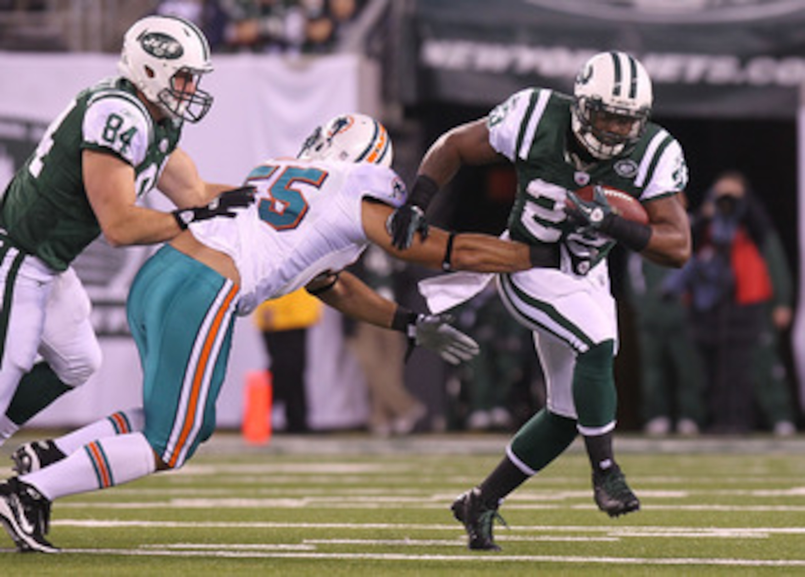 EAST RUTHERFORD, NJ - DECEMBER 12: Shonn Greene #23 of the New York Jets rushes against the Miami Dolphins at New Meadowlands Stadium on December 12, 2010 in East Rutherford, New Jersey.  (Photo by Nick Laham/Getty Images)