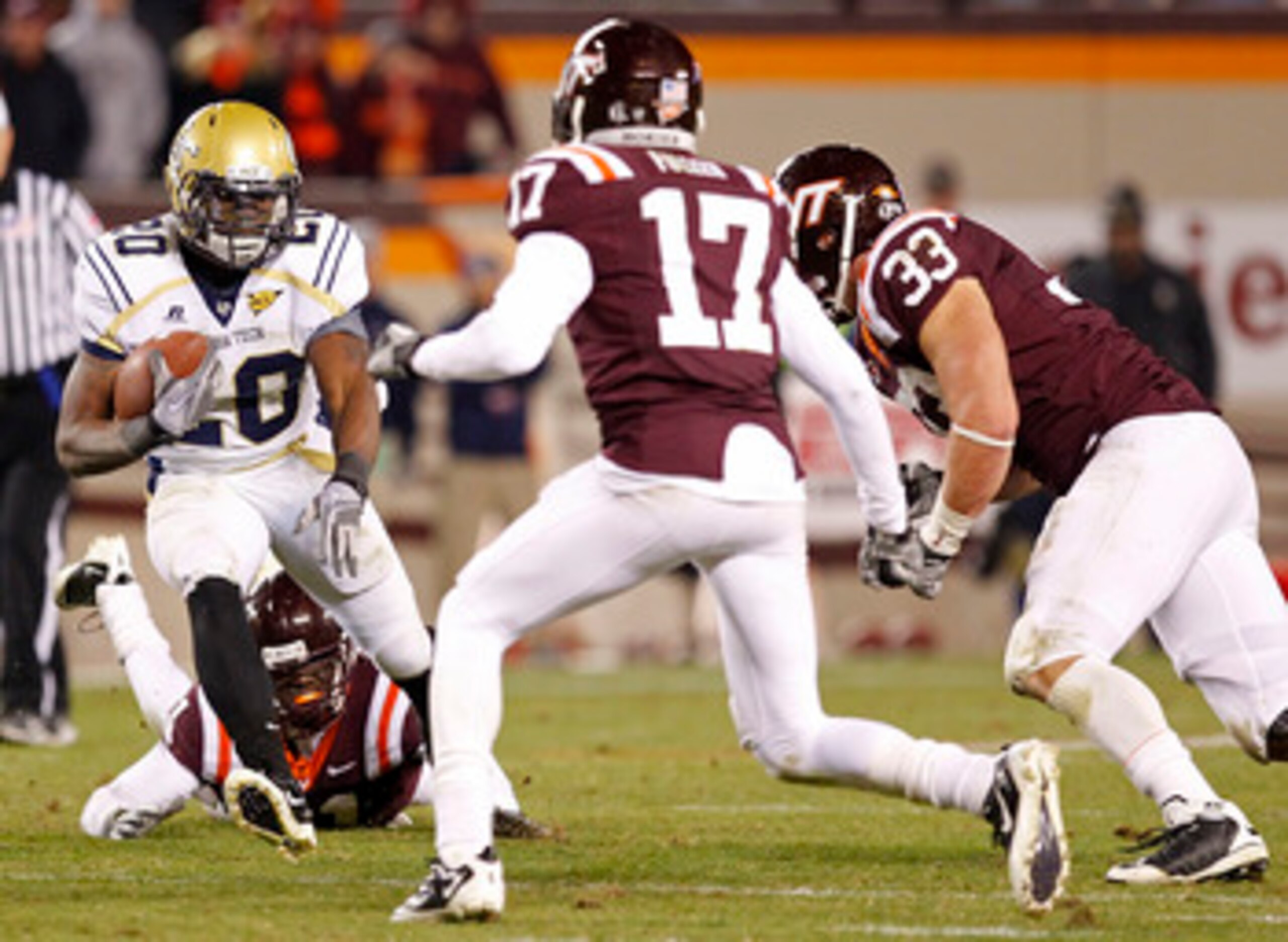 BLACKSBURG, VA - NOVEMBER 04: Running back Roddy Jones #20 of the Georgia Tech Yellow Jackets runs with the ball as defensive end Chris Drager #33 of the Virginia Tech Hokies and cornerback Kyle Fuller #17 of the Virginia Tech Hokies chase at Lane Stadium
