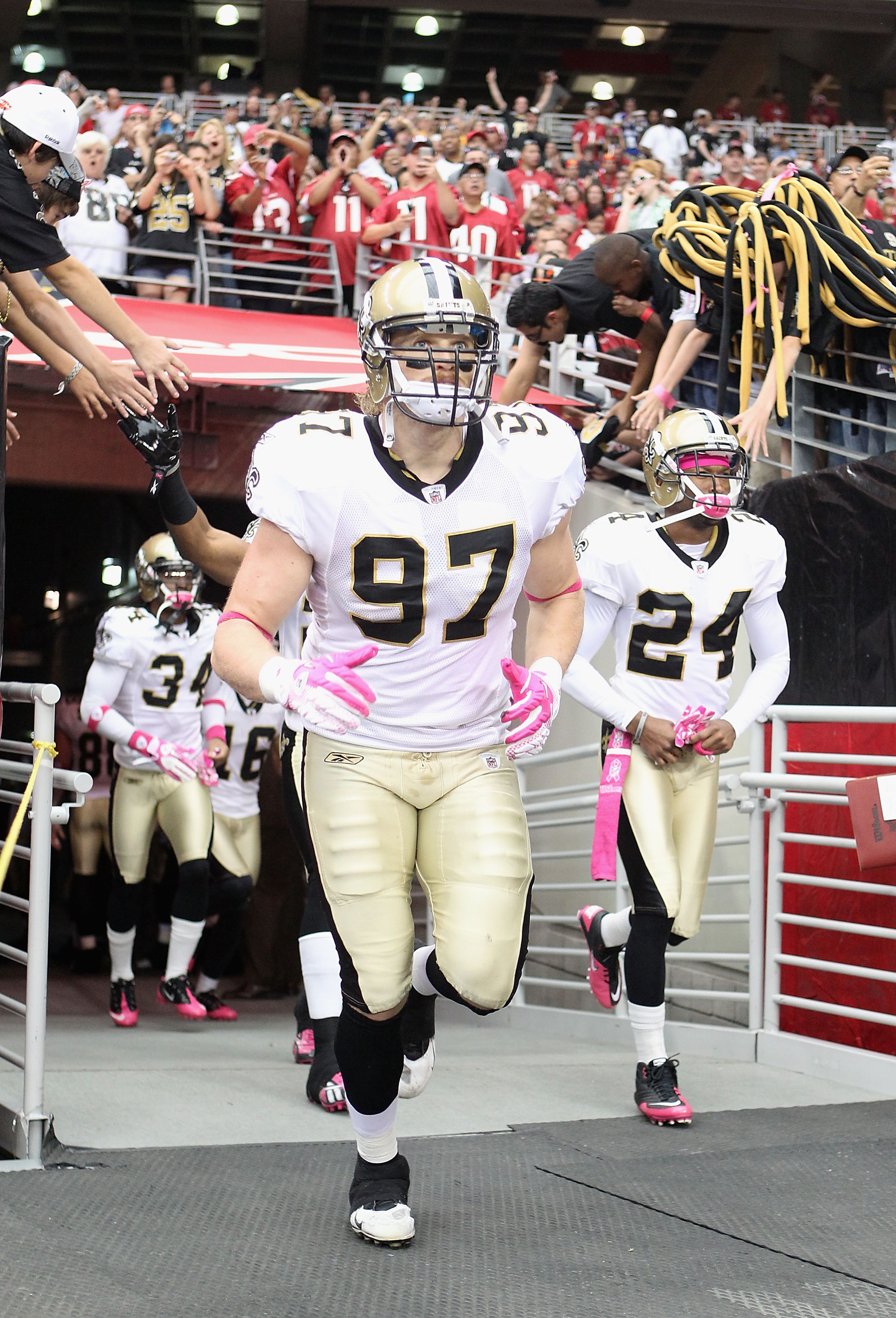 GLENDALE, AZ - OCTOBER 10:  Defensive end Jeff Charleston #97 of the New Orleans Saints runs out onto the field before the NFL game against the Arizona Cardinals at the University of Phoenix Stadium on October 10, 2010 in Glendale, Arizona.  (Photo by Chr