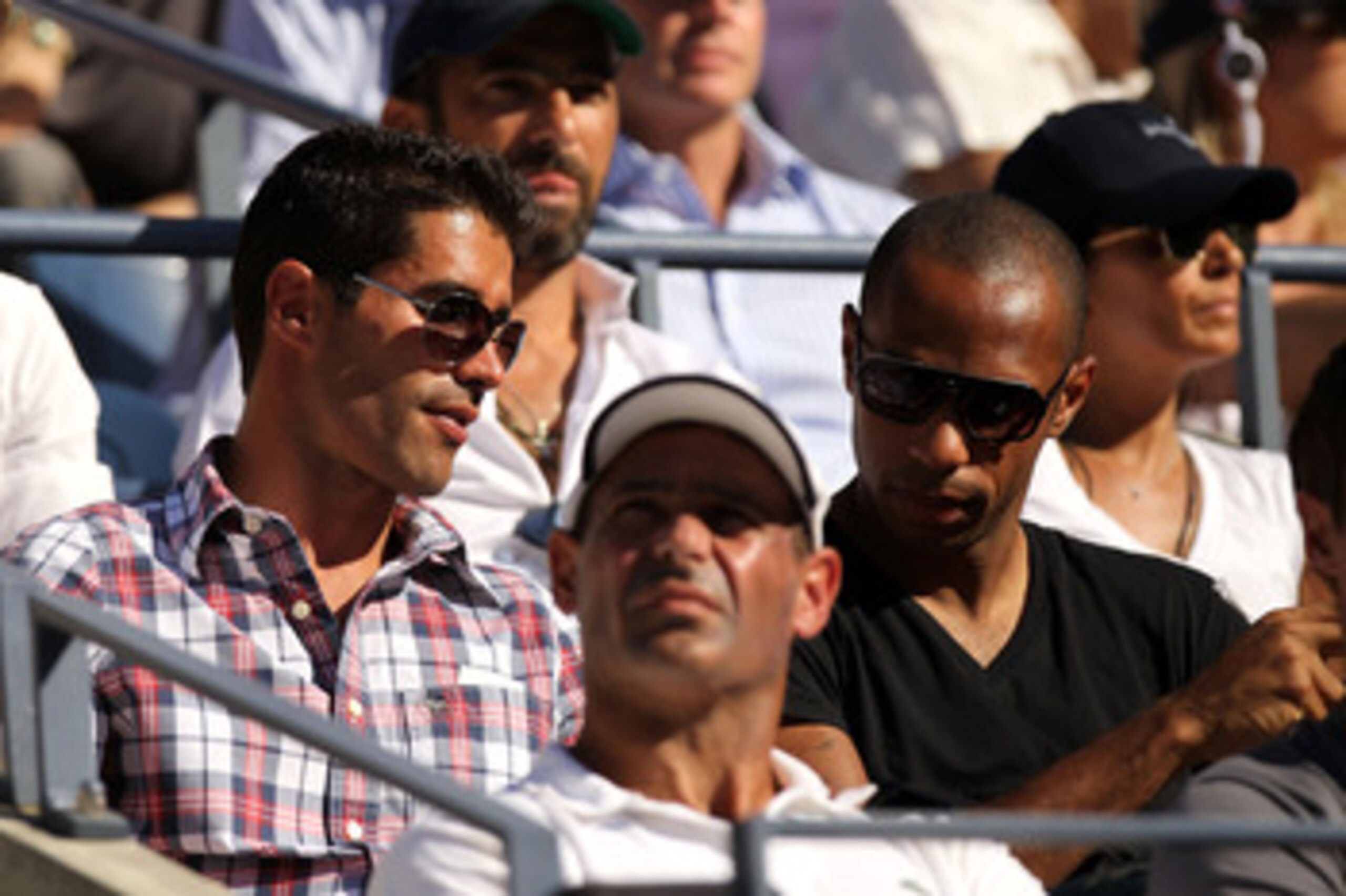NEW YORK - SEPTEMBER 08:  French Soccer Player Thierry Henry (R) attends day ten of the 2010 U.S. Open at the USTA Billie Jean King National Tennis Center on September 8, 2010 in the Flushing neighborhood of the Queens borough of New York City.  (Photo by