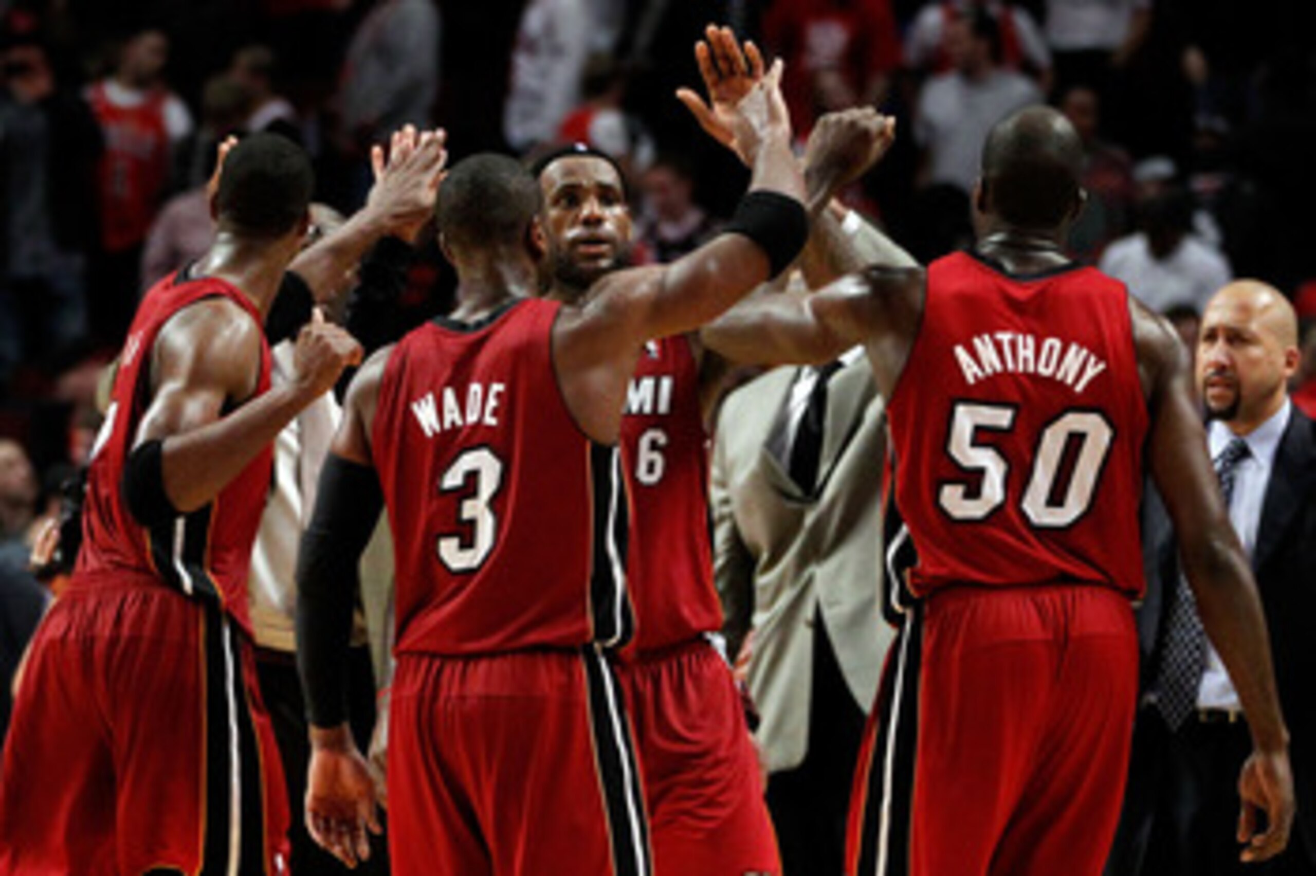 CHICAGO, IL - MAY 18: (L-R) Dwyane Wade #3, LeBron James #6 and Joel Anthony #50 of the Miami Heat celebrate after they won 85-75 against the Chicago Bulls in Game Two of the Eastern Conference Finals during the 2011 NBA Playoffs on May 18, 2011 at the Un