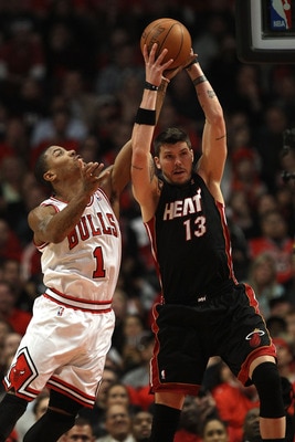 CHICAGO, IL - MAY 15:  Mike Miller #13 of the Miami Heat grabs a rebound against Derrick Rose #1 of the Chicago Bulls in Game One of the Eastern Conference Finals during the 2011 NBA Playoffs on May 15, 2011 at the United Center in Chicago, Illinois. The