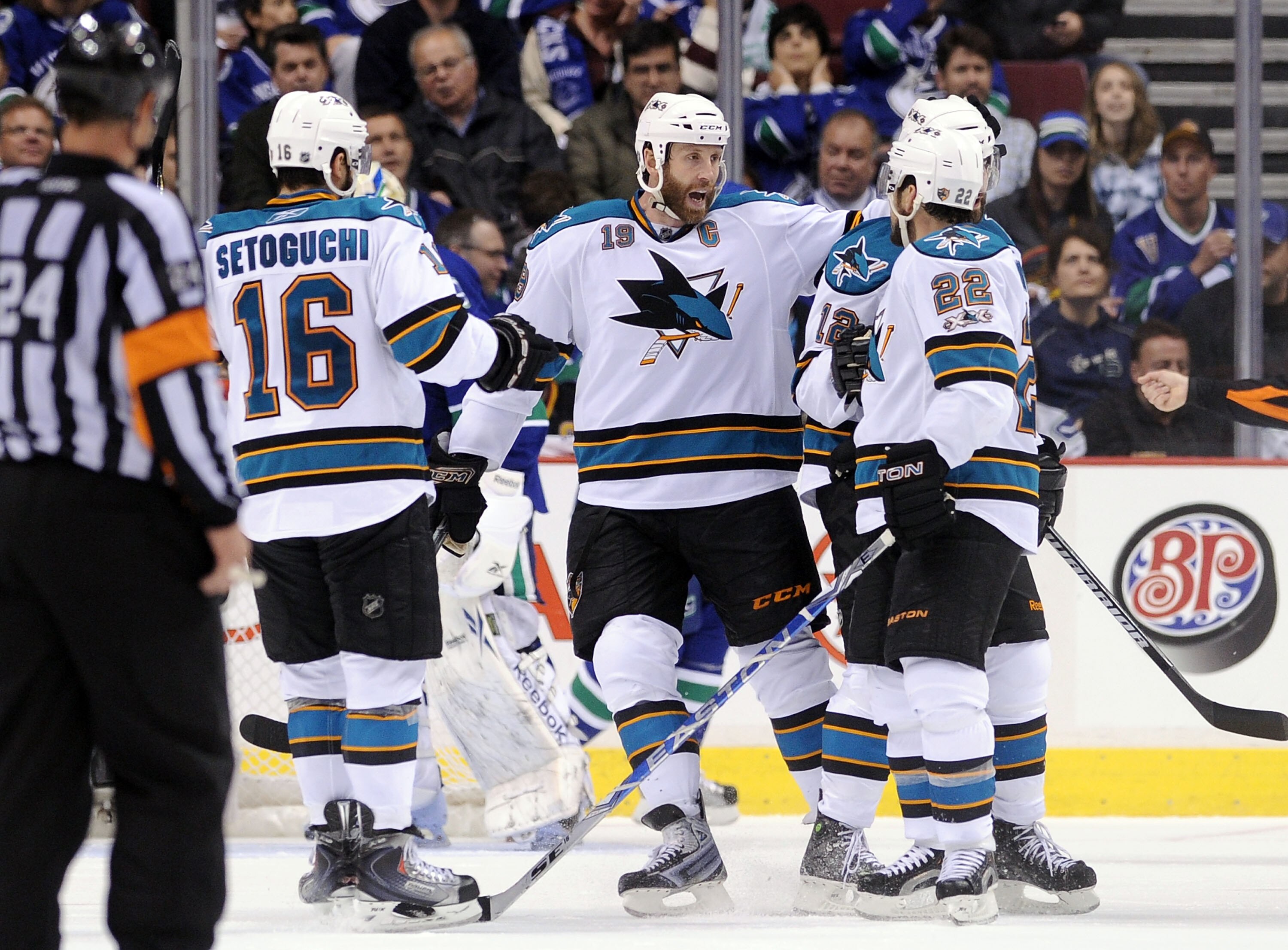 VANCOUVER, CANADA - MAY 15:  Devin Setoguchi #16, Joe Thornton #19 and Dan Boyle #22 of the San Jose Sharks celebrate with teammate Patrick Marleau #12 after Marleau's goal in Game One of the Western Conference Finals against the Vancouver Canucks during