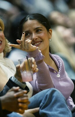 LOS ANGELES - NOVEMBER 22:  Film actress Salma Hayek sits courtside during the NBA game between the Chicago Bulls and the Los Angeles Lakers at Staples Center on November 22, 2002 in Los Angeles, California.  The Lakers won 86-73.  NOTE TO USER: User expr