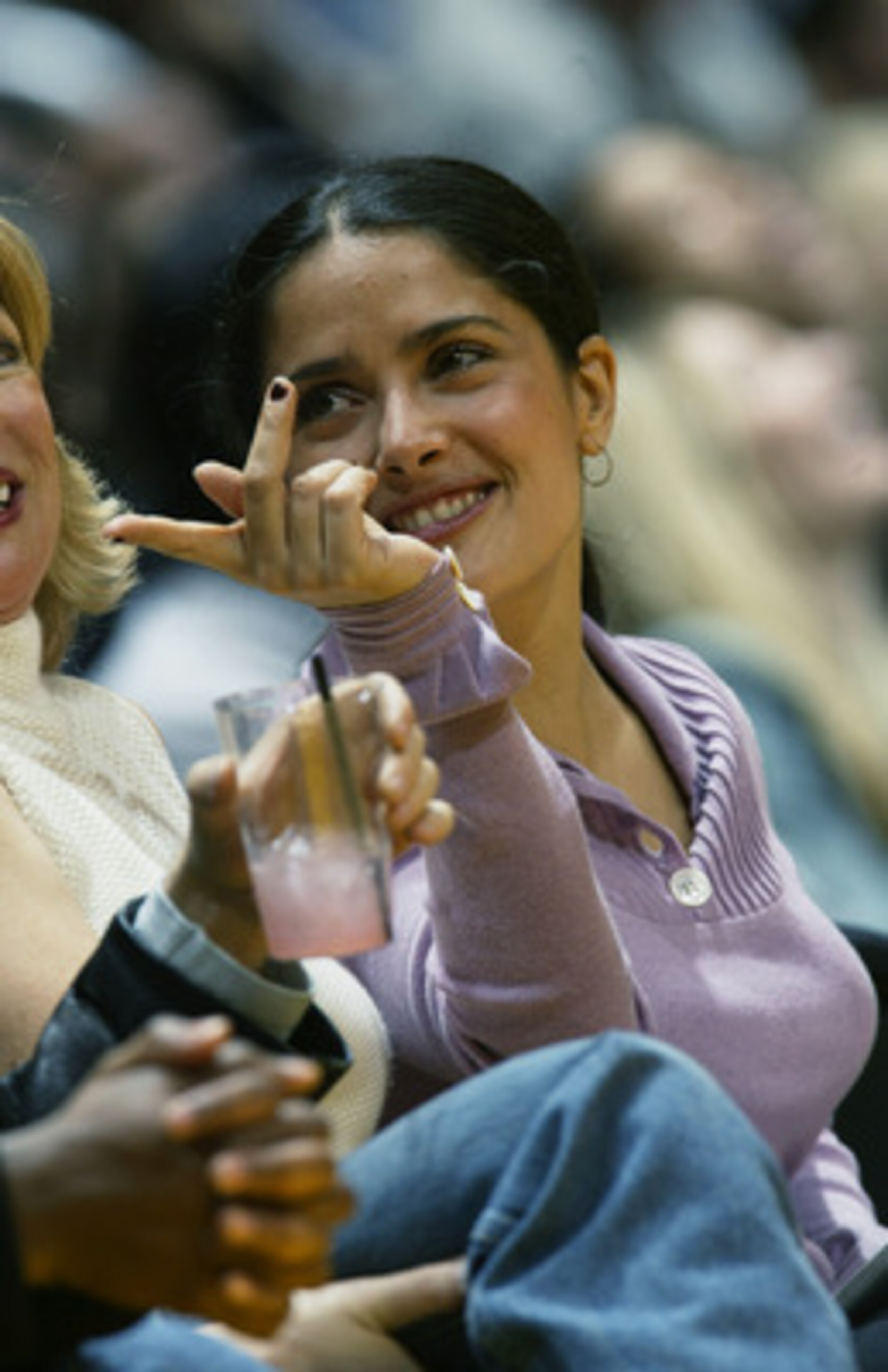 LOS ANGELES - NOVEMBER 22:  Film actress Salma Hayek sits courtside during the NBA game between the Chicago Bulls and the Los Angeles Lakers at Staples Center on November 22, 2002 in Los Angeles, California.  The Lakers won 86-73.  NOTE TO USER: User expr