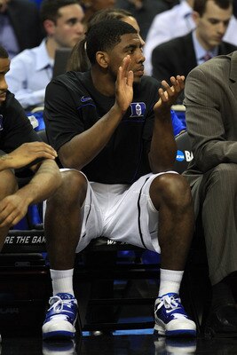 CHARLOTTE, NC - MARCH 18:  Kyrie Irving #1 of the Duke Blue Devils cheers from the bench in the first half while taking on the Hampton Pirates during the second round of the 2011 NCAA men's basketball tournament at Time Warner Cable Arena on March 18, 201