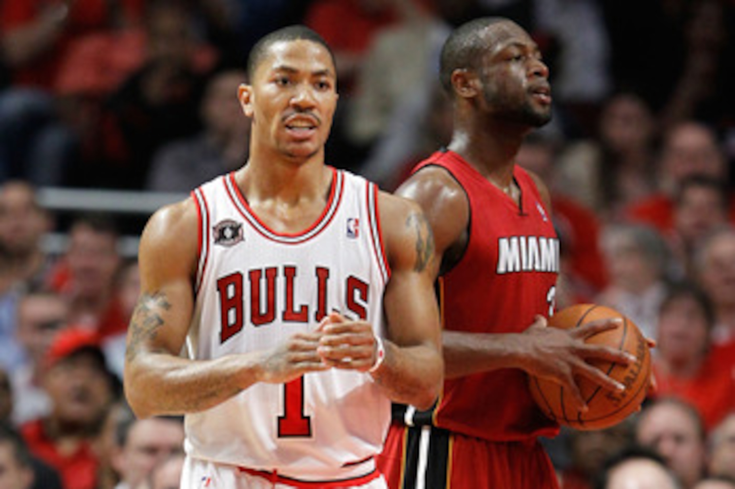 CHICAGO, IL - MAY 18: (L-R) Derrick Rose #1 of the Chicago Bulls and Dwyane Wade #3 of the Miami Heat look on in Game Two of the Eastern Conference Finals during the 2011 NBA Playoffs on May 18, 2011 at the United Center in Chicago, Illinois. NOTE TO USER