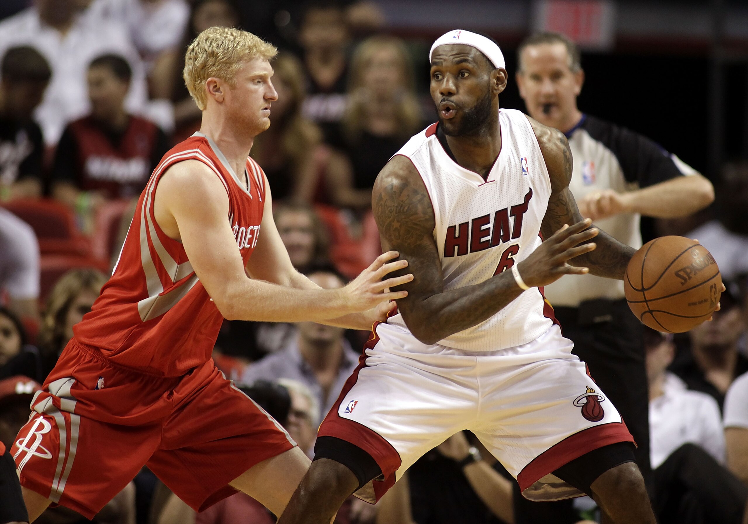 MIAMI, FL - MARCH 27:  Forward LeBron James #6  of the Miami Heat reacts battles against Forward Chase Budinger #10 of the Houston Rockets  at American Airlines Arena on March 27, 2011 in Miami, Florida. NOTE TO USER: User expressly acknowledges and agree