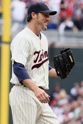 MINNEAPOLIS, MN - APRIL 08:  Closing pitcher Joe Nathan #36 of the Minnesota Twins celebrates the win during Opening Day on April 8, 2011 at Target Field in Minneapolis, Minnesota. The Minnesota Twins defeated the Oakland Athletics 2-1.  (Photo by Elsa/Ge