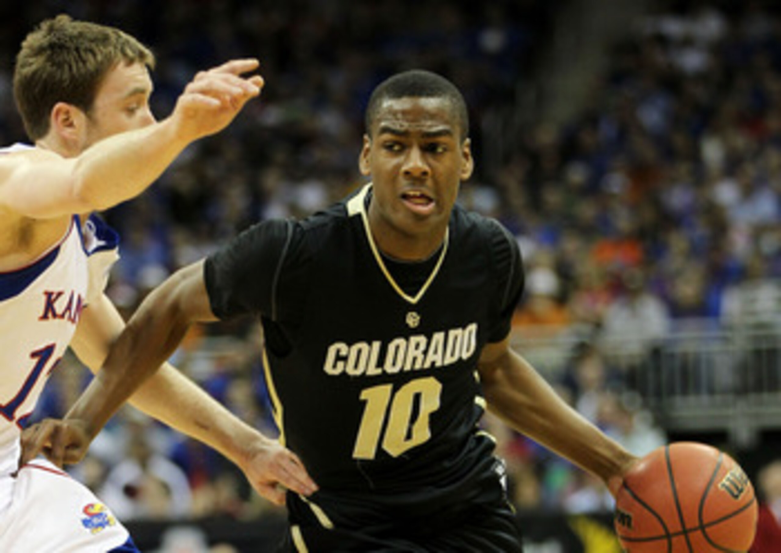 KANSAS CITY, MO - MARCH 11:  Alec Burks #10 of the Colorado Buffaloes drives with the ball against the Kansas Jayhawks during their semifinal game in the 2011 Phillips 66 Big 12 Men's Basketball Tournament at Sprint Center on March 11, 2011 in Kansas City