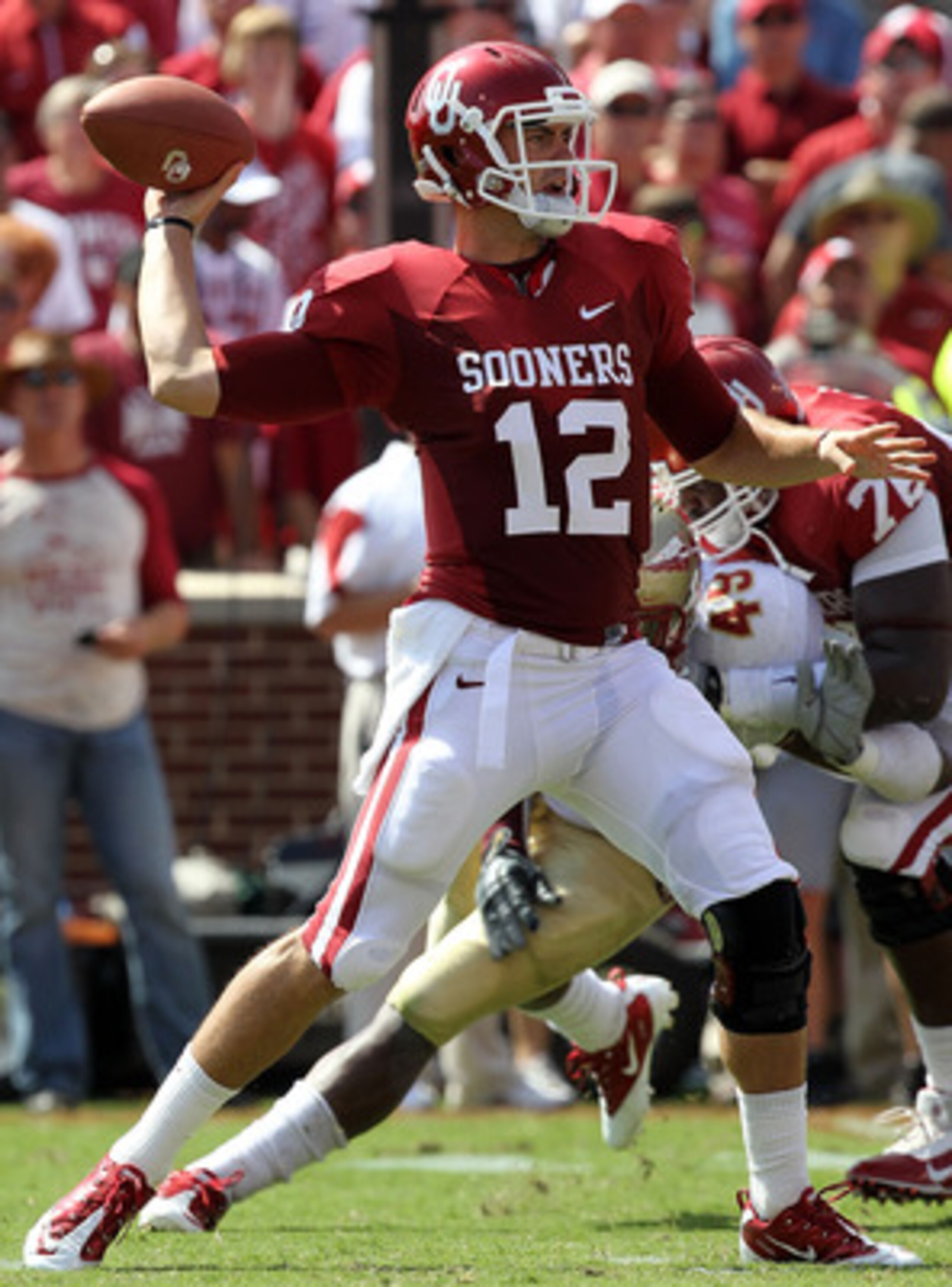 NORMAN, OK - SEPTEMBER 11:  Quarterback Landry Jones #12 of the Oklahoma Sooners drops back to pass against the Florida State Seminoles in the first quarter at Gaylord Family Oklahoma Memorial Stadium on September 11, 2010 in Norman, Oklahoma.  (Photo by
