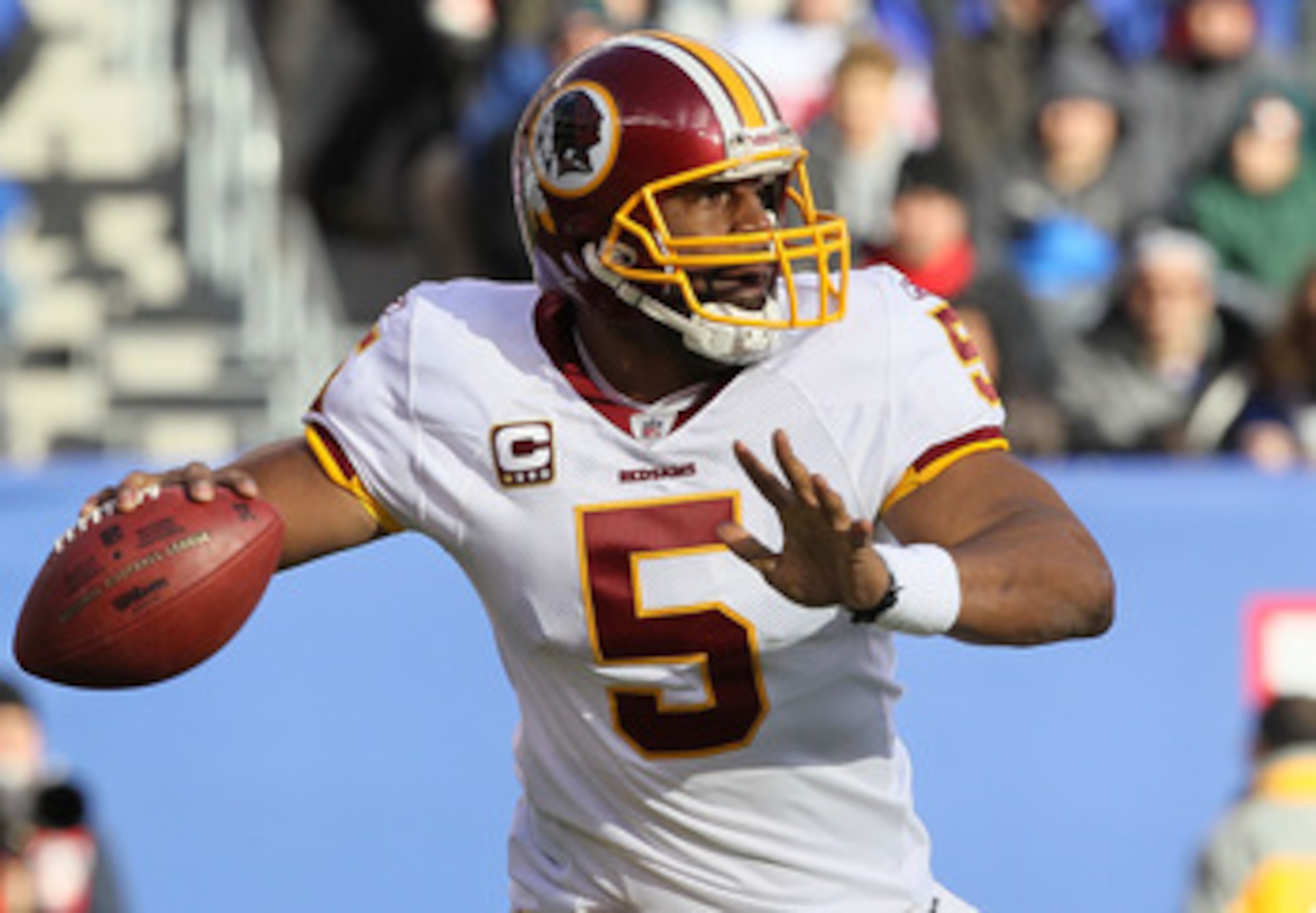 EAST RUTHERFORD, NJ - DECEMBER 05:  Donovan McNabb #5 of the Washington Redskins throws a pass against the New York Giants on December 5, 2010 at the New Meadowlands Stadium in East Rutherford, New Jersey. The Giants defeated the Redskins 31-7.  (Photo by