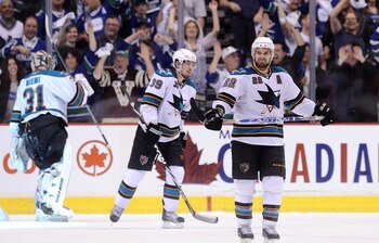 VANCOUVER, BC - MAY 18:  Logan Couture #39 and Dan Boyle #22 of the San Jose Sharks look on after a goal by Mason Raymond #21 of the Vancouver Canucks (not in photo) in the third period in Game Two of the Western Conference Finals during the 2011 Stanley