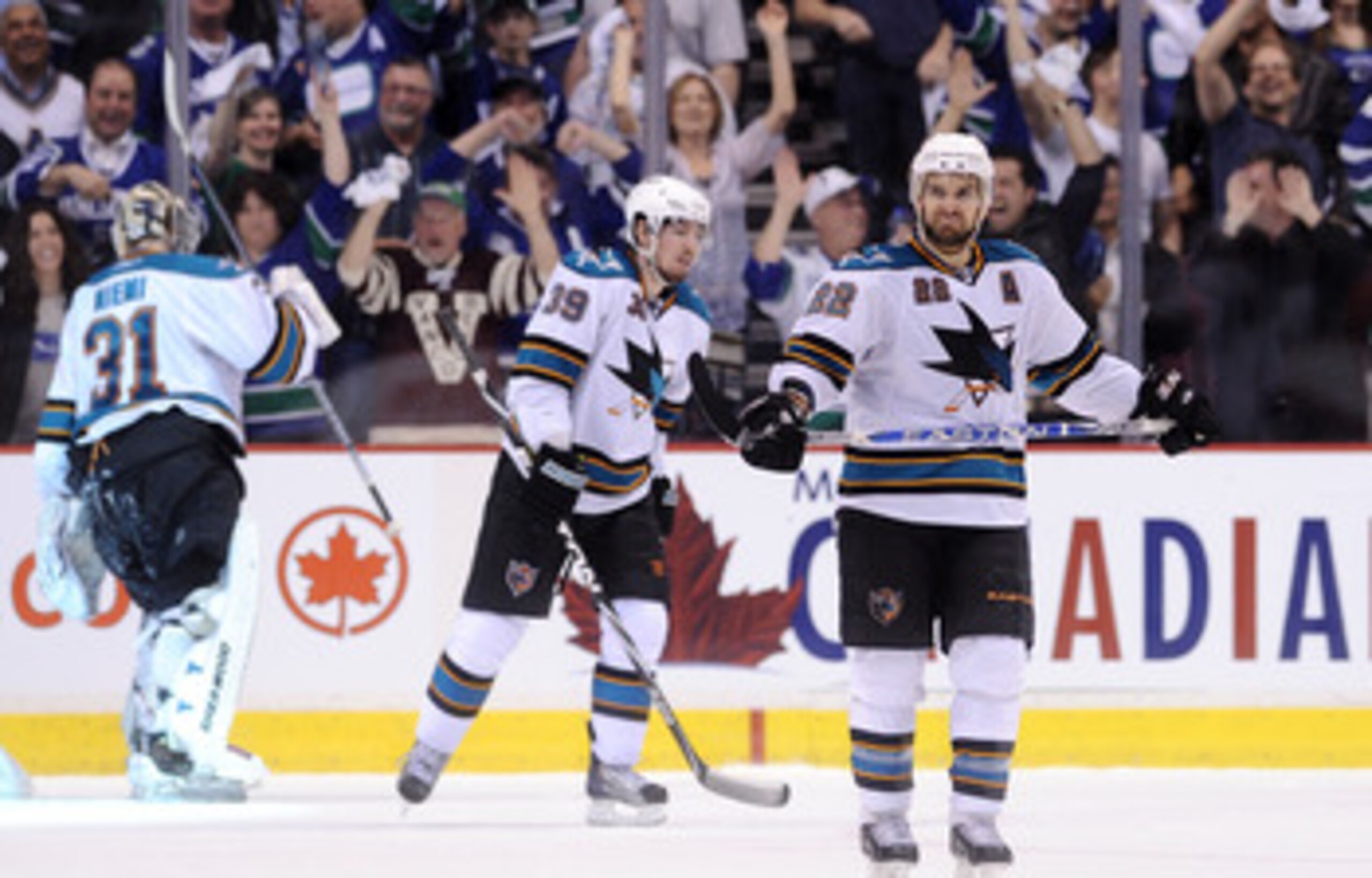 VANCOUVER, BC - MAY 18: Logan Couture #39 and Dan Boyle #22 of the San Jose Sharks look on after a goal by Mason Raymond #21 of the Vancouver Canucks (not in photo) in the third period in Game Two of the Western Conference Finals during the 2011 Stanley VANCOUVER, BC - MAY 18: Logan Couture #39 and Dan Boyle #22 of the San Jose Sharks look on after a goal by Mason Raymond #21 of the Vancouver Canucks (not in photo) in the third period in Game Two of the Western Conference Finals during the 2011 Stanley