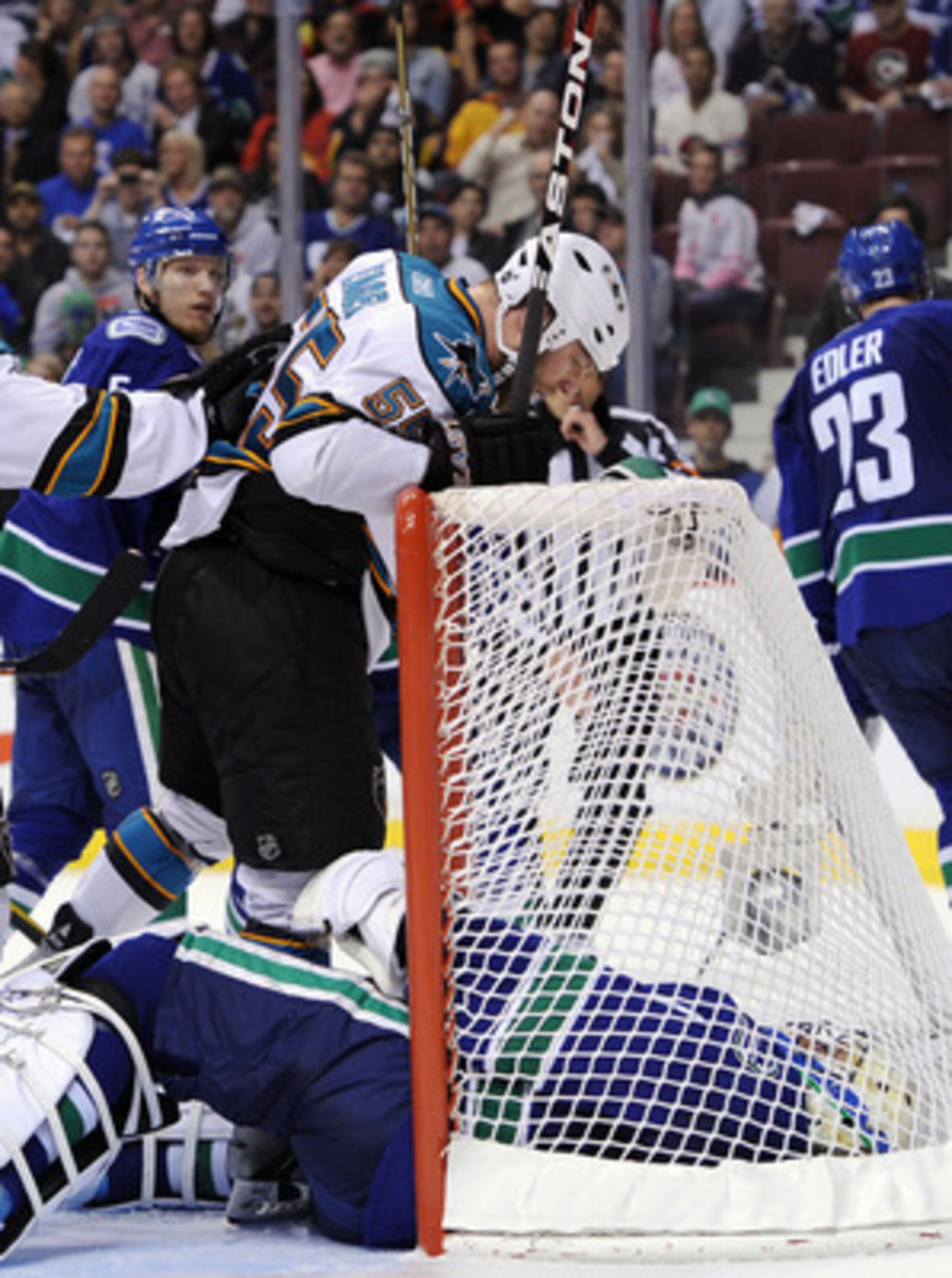VANCOUVER, BC - MAY 18: Ben Eager #55 of the San Jose Sharks stands over and taunts goaltender Roberto Luongo #1 of the Vancouver Canucks after scoring a goal late in the third period in Game Two of the Western Conference Finals during the 2011 Stanley C VANCOUVER, BC - MAY 18: Ben Eager #55 of the San Jose Sharks stands over and taunts goaltender Roberto Luongo #1 of the Vancouver Canucks after scoring a goal late in the third period in Game Two of the Western Conference Finals during the 2011 Stanley C