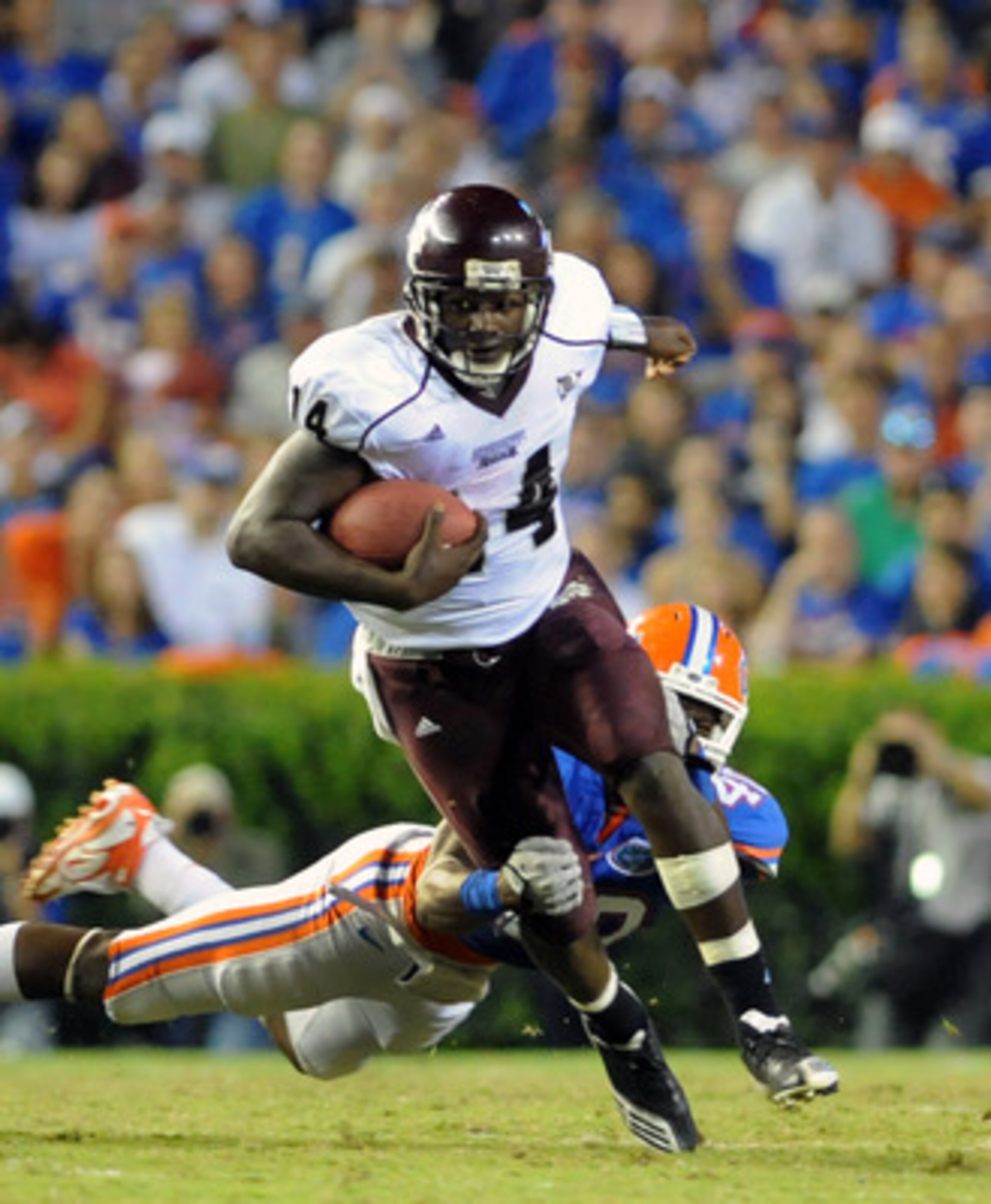 GAINESVILLE, FL - OCTOBER 16:  Quarterback Chris Relf #14 of the Mississippi State Bulldogs rushes upfield against the Florida Gators October 16, 2010 Ben Hill Griffin Stadium at Gainesville, Florida.  (Photo by Al Messerschmidt/Getty Images)