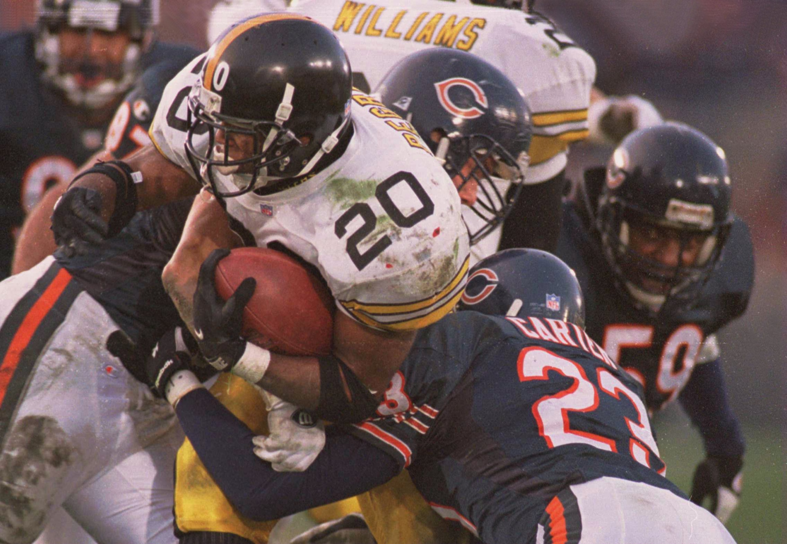 5 NOV 1995:  PITTSBURGH RUNNING BACK ERRIC PEGRAM, #20, IS WRAPPED UP BY MARTY CARTER, #23, AND JIM FLANIGAN, #99, OF CHICAGO IN THE SECOND QUARTER AT SOLDIER FIELD IN CHICAGO, ILLINOIS. Mandatory Credit: Matthew Stockman/ALLSPORT
