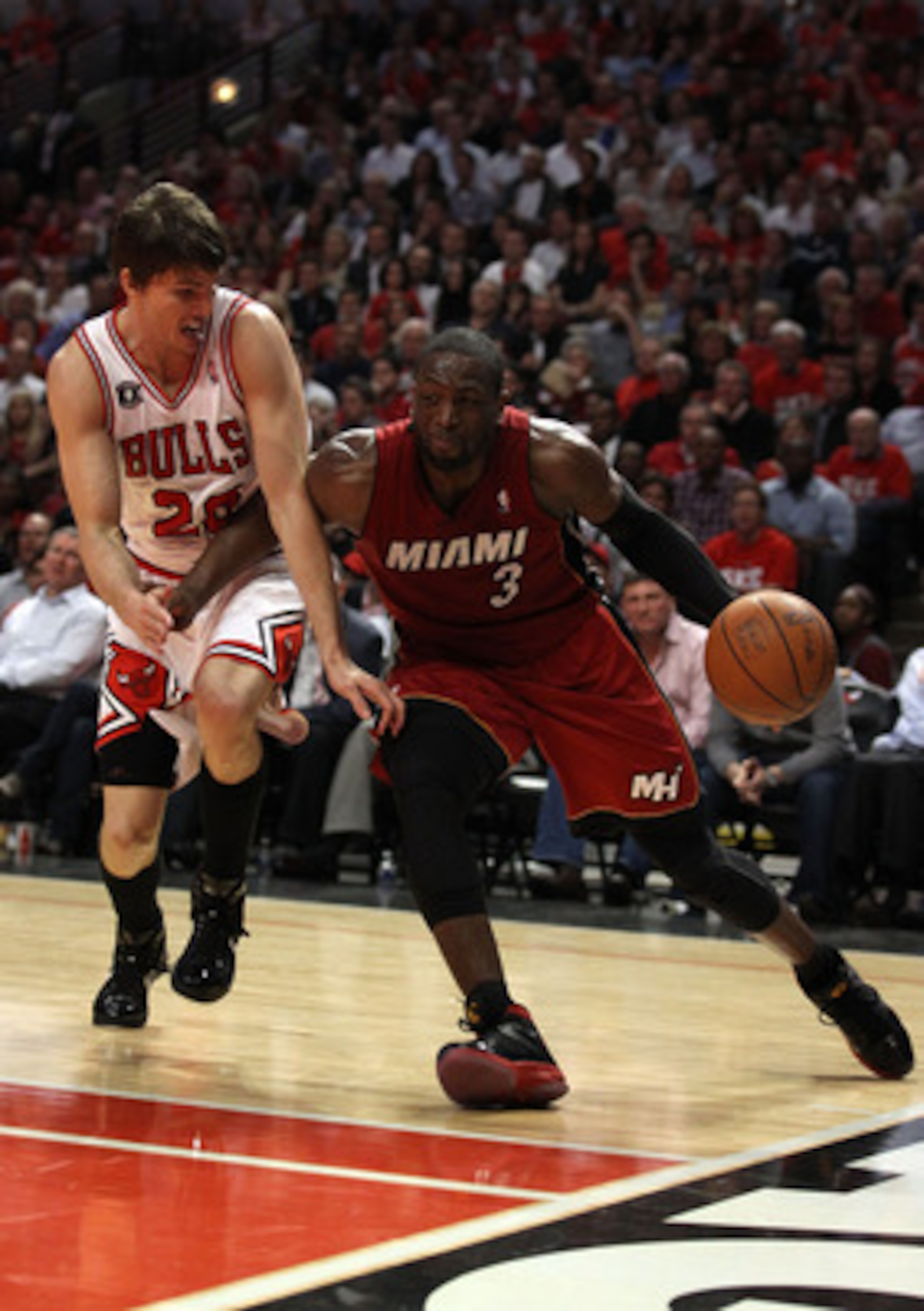 CHICAGO, IL - MAY 18: Dwyane Wade #3 of the Miami Heat drives against Kyle Korver #26 of the Chicago Bulls in Game Two of the Eastern Conference Finals during the 2011 NBA Playoffs on May 18, 2011 at the United Center in Chicago, Illinois. NOTE TO USER: CHICAGO, IL - MAY 18: Dwyane Wade #3 of the Miami Heat drives against Kyle Korver #26 of the Chicago Bulls in Game Two of the Eastern Conference Finals during the 2011 NBA Playoffs on May 18, 2011 at the United Center in Chicago, Illinois. NOTE TO USER:
