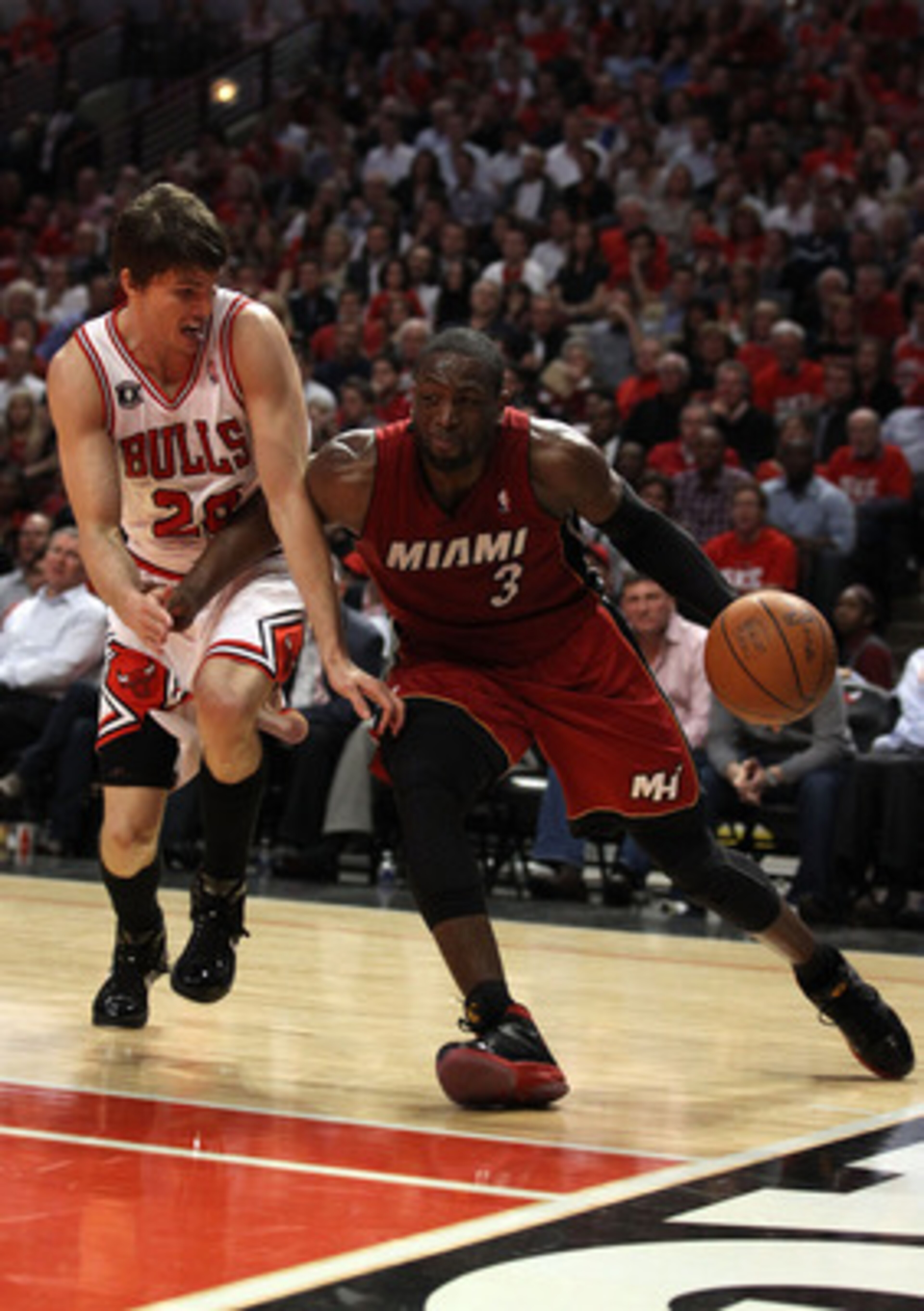 CHICAGO, IL - MAY 18: Dwyane Wade #3 of the Miami Heat drives against Kyle Korver #26 of the Chicago Bulls in Game Two of the Eastern Conference Finals during the 2011 NBA Playoffs on May 18, 2011 at the United Center in Chicago, Illinois. NOTE TO USER: CHICAGO, IL - MAY 18: Dwyane Wade #3 of the Miami Heat drives against Kyle Korver #26 of the Chicago Bulls in Game Two of the Eastern Conference Finals during the 2011 NBA Playoffs on May 18, 2011 at the United Center in Chicago, Illinois. NOTE TO USER: