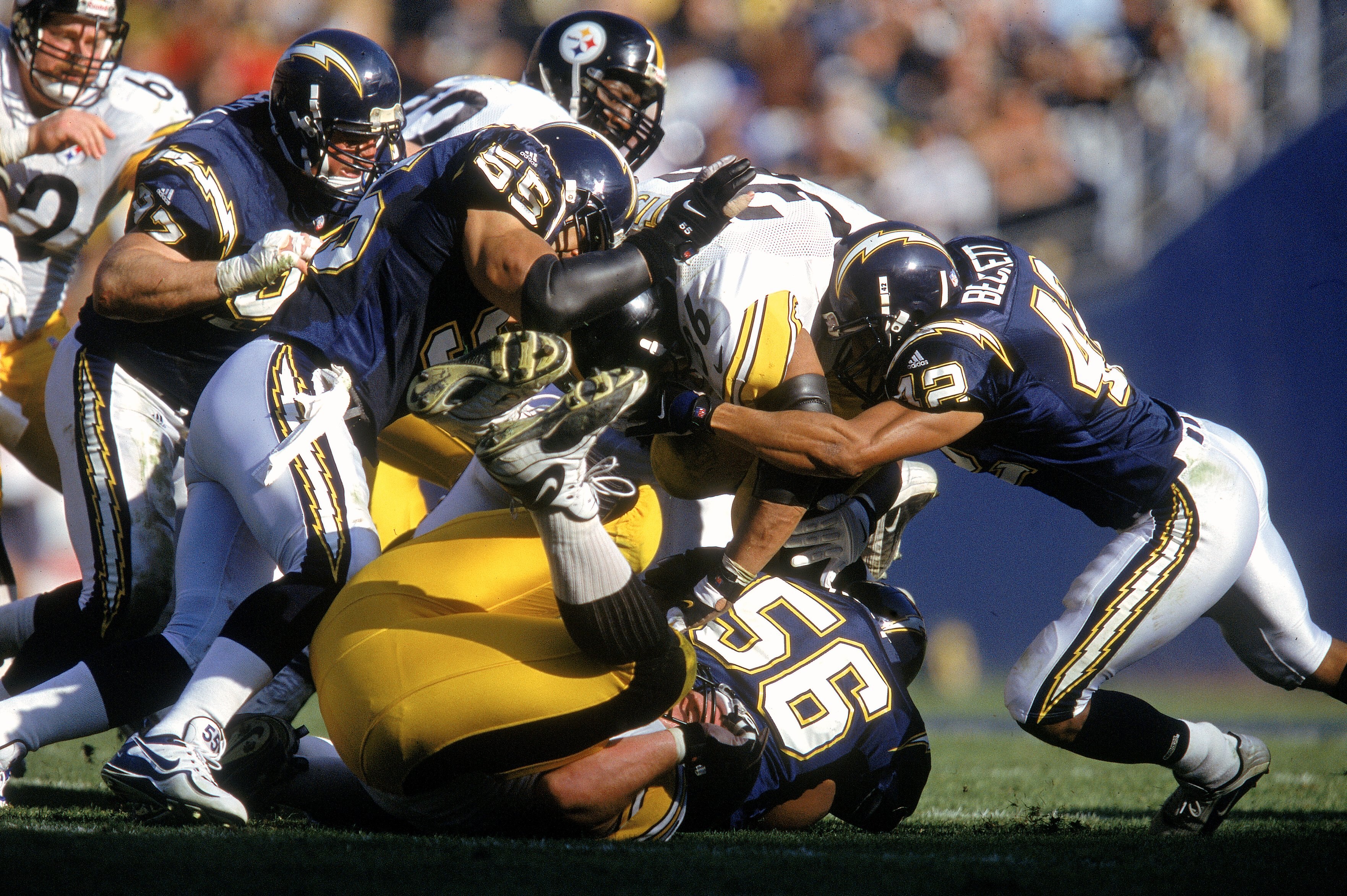 24 Dec 2000:   Junior Seau #55 of the San Diego Chargers moves for the ball with Rogers Beckett #42 and Jerome Bettis #36 of the Pittsburgh Steelers at Qualcomm Stadium in San Diego, California. The Steelers defeated the Chargers 34-21.Mandatory Credit: J