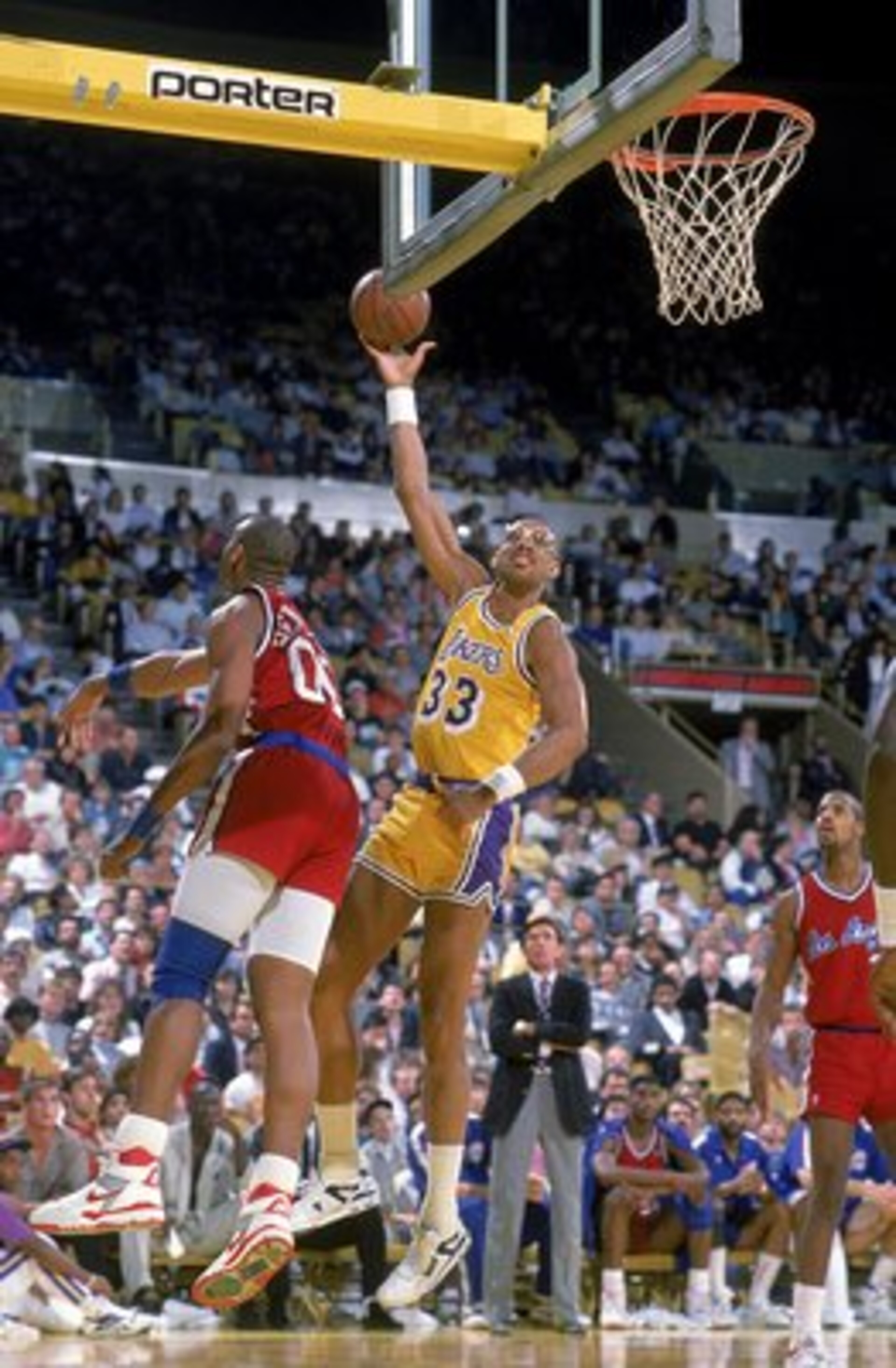 1989: Kareem Abdul- Jabbar of the Los Angeles Lakers makes a layup as Benoit Benjamin of the LA Clippers tries to block him. Mandatory Credit: Stephen Dunn /Allsport 1989: Kareem Abdul- Jabbar of the Los Angeles Lakers makes a layup as Benoit Benjamin of the LA Clippers tries to block him. Mandatory Credit: Stephen Dunn /Allsport