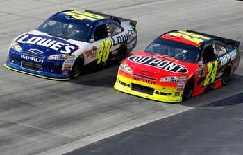 DOVER, DE - MAY 15: Jimmie Johnson, driver of the #48 Lowe's Chevrolet, races Jeff Gordon, driver of the #24 Dupont Chevrolet, during the NASCAR Sprint Cup Series FedEx 400 Benefiting Autism Speaks at Dover International Speedway on May 15, 2011 in Dover,