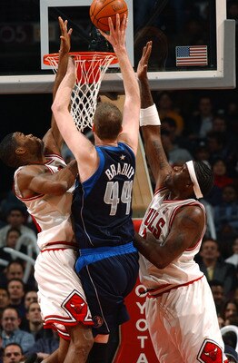 CHICAGO - JANUARY 23:  Forward Antonio Davis #34 and center Eddy Curry #2 of the Chicago Bulls pressure center Shawn Bradley #44 of the Dallas Mavericks as he shoots during a game on January 23, 2004 at the United Center in Chicago, Illinois. The Maverick