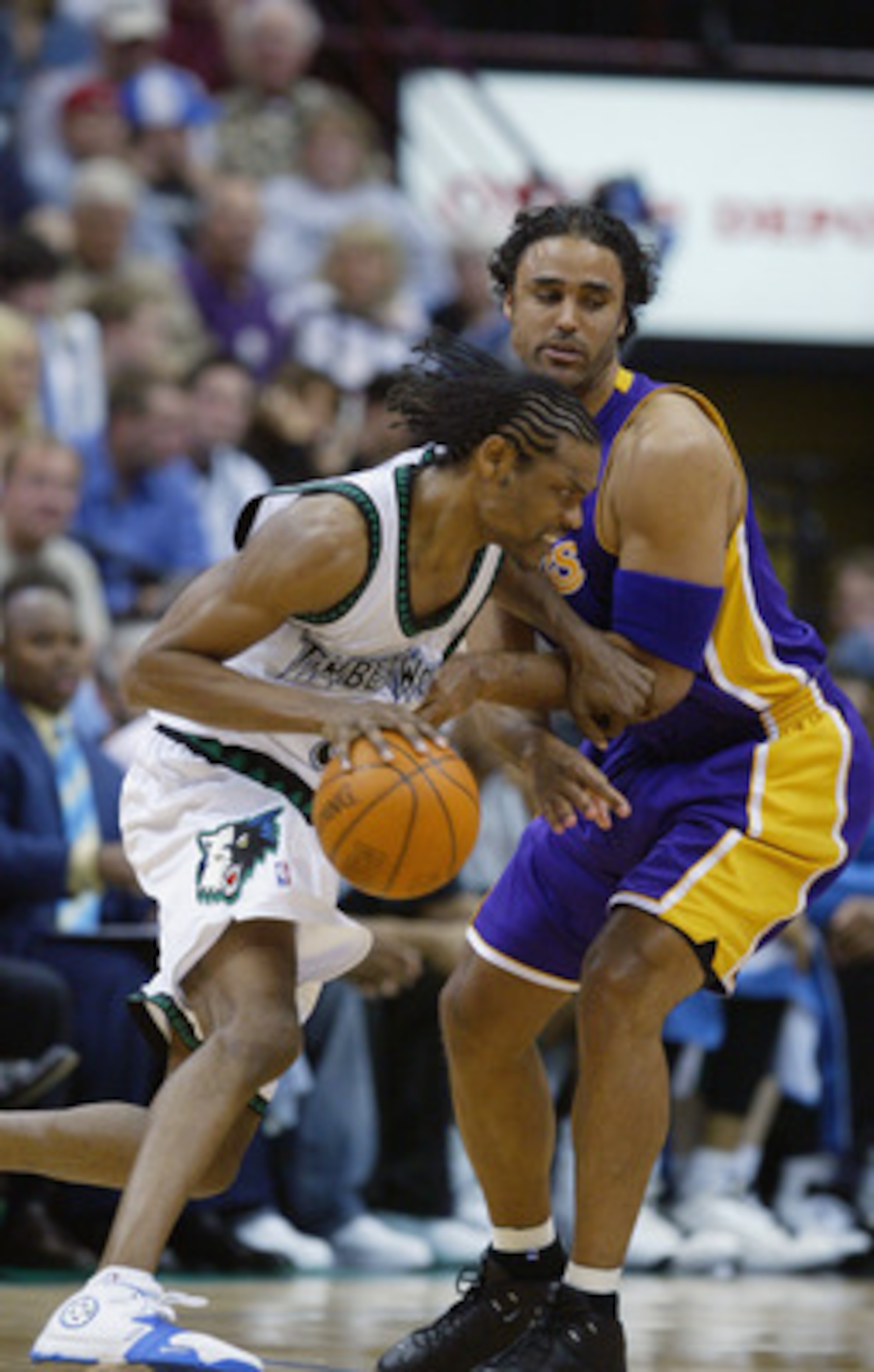 MINNEAPOLIS - MAY 29: Latrell Sprewell #8 of the Minnesota Timberwolves drives around Rick Fox #17 of the Los Angeles Lakers in Game five of the Western Conference Finals during the 2004 NBA Playoffs at Target Center on May 29, 2004 in Minneapolis, Minne MINNEAPOLIS - MAY 29: Latrell Sprewell #8 of the Minnesota Timberwolves drives around Rick Fox #17 of the Los Angeles Lakers in Game five of the Western Conference Finals during the 2004 NBA Playoffs at Target Center on May 29, 2004 in Minneapolis, Minne